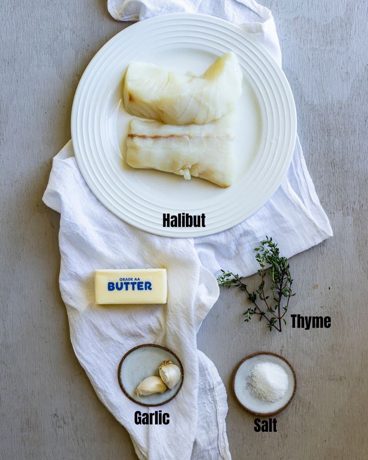 Ingredients to make sous vide halibut arranged individually and labelled.