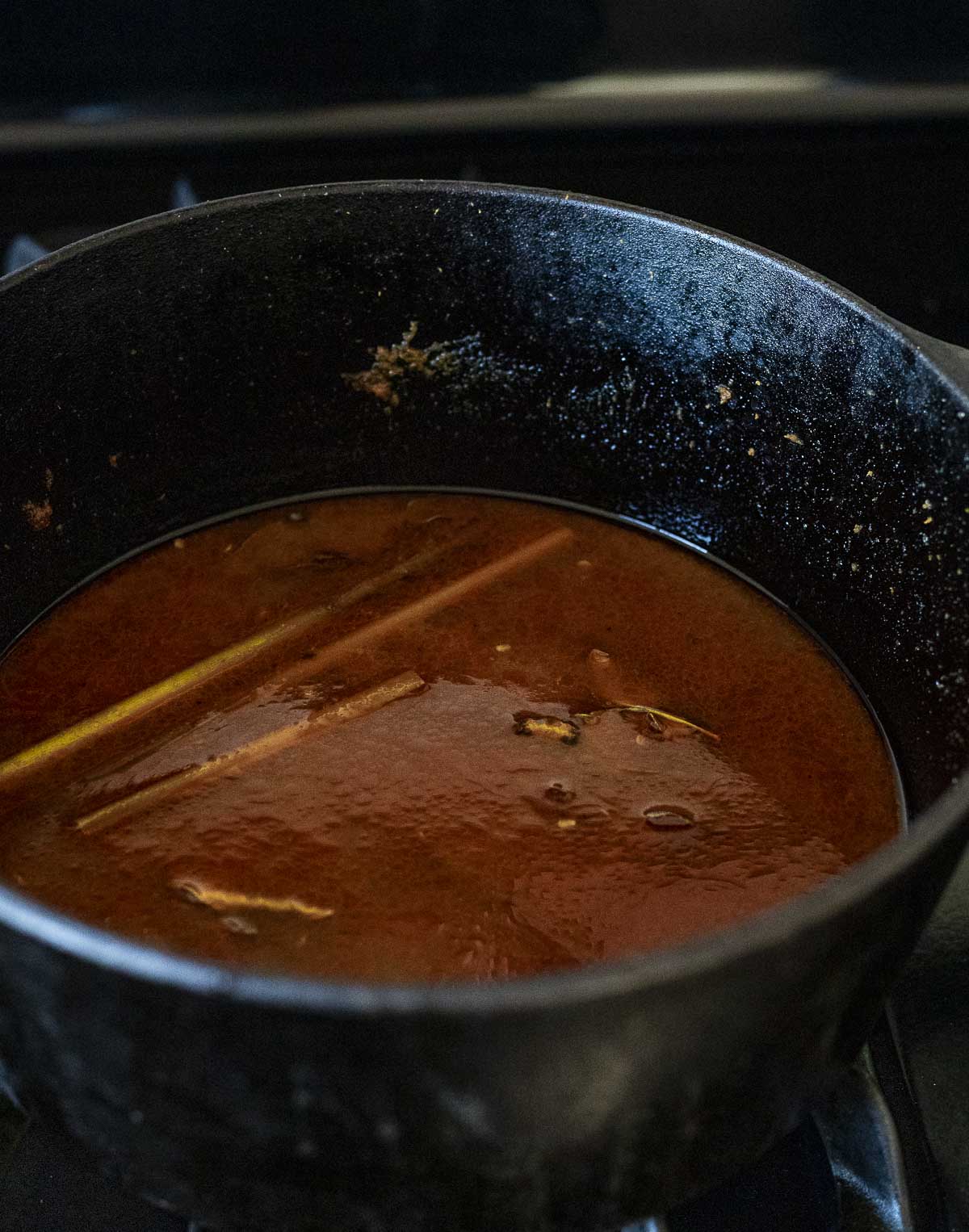 Laksa broth being made in a large pot.