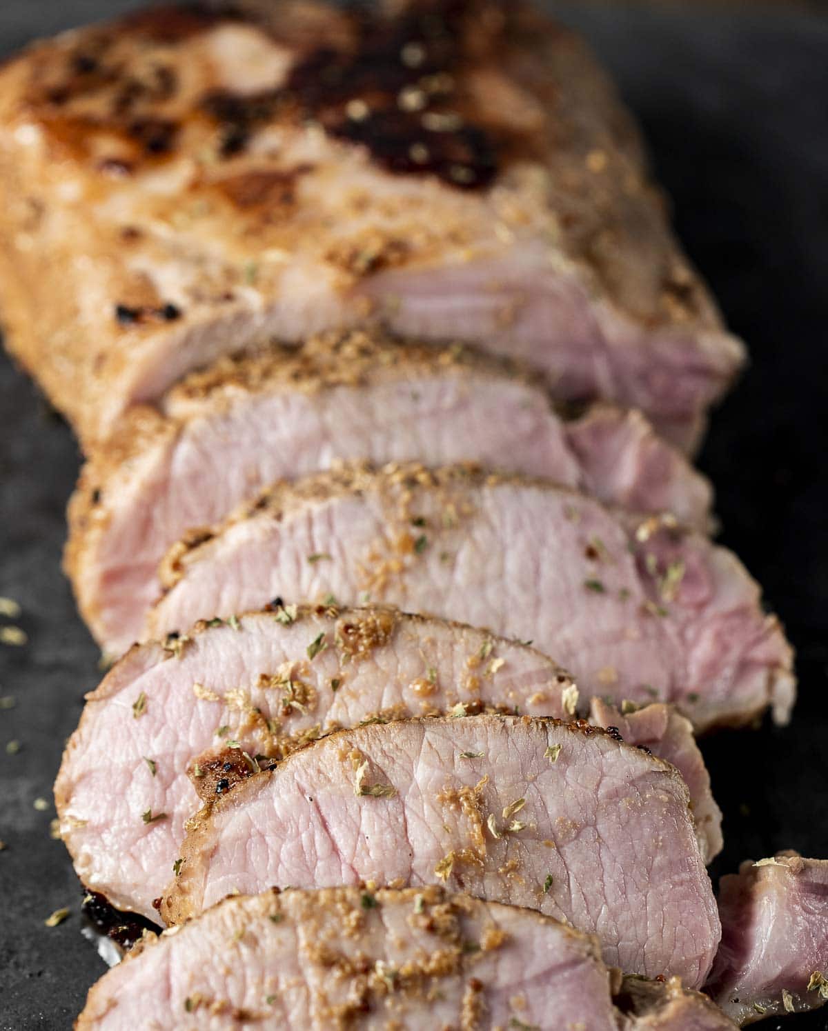 Close up view of sliced pork roast.