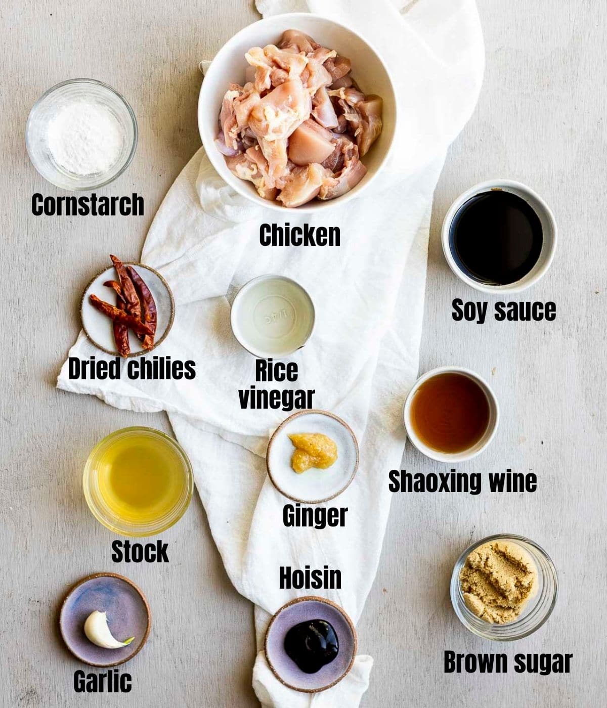 Ingredients to make air fryer general tso's chicken arranged individually and labeled.