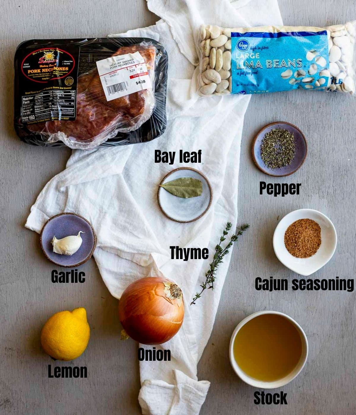 Ingredients to make Instant Pot lima beans arranged individually and labelled.