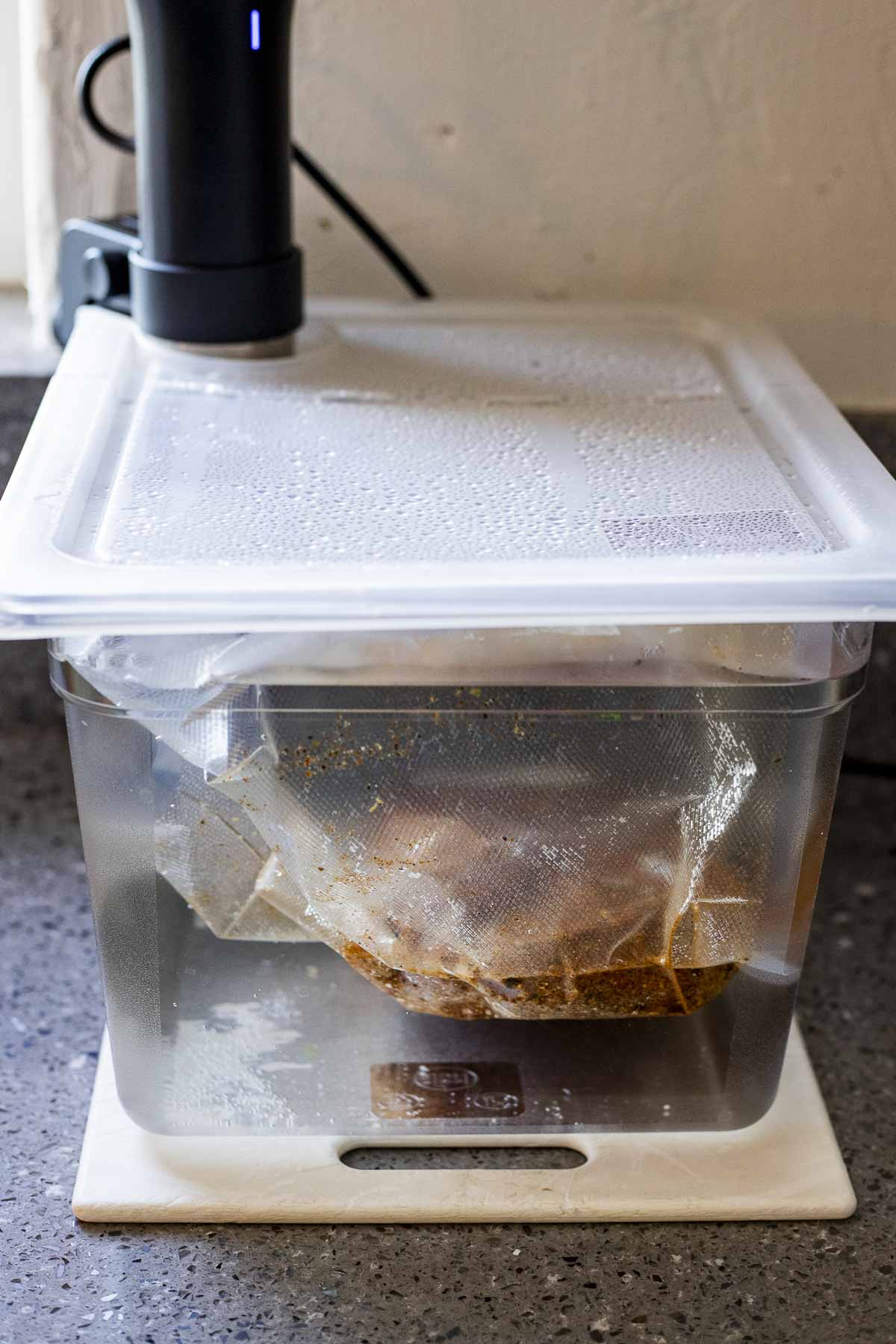 Pastrami cooking in a sous vide water bath.