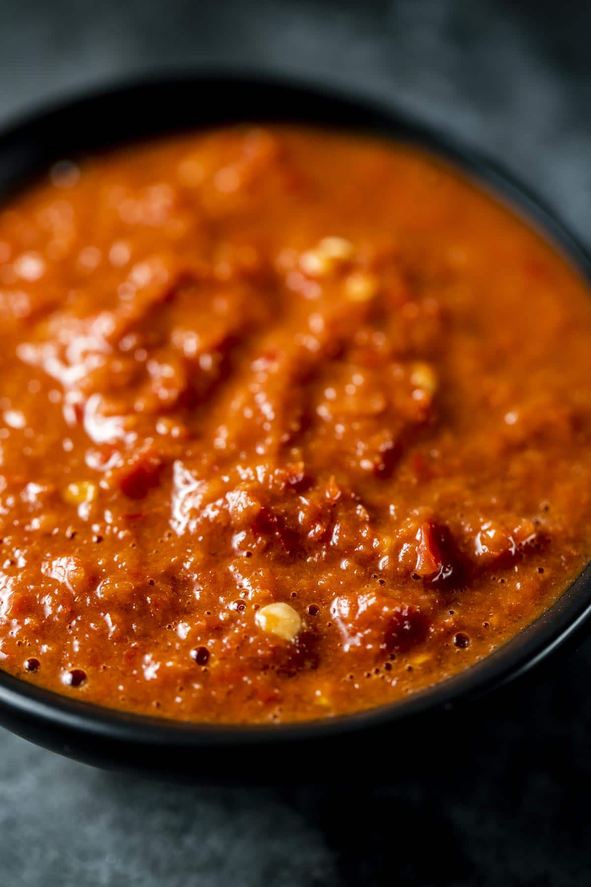Close up ¾ view of sambal belacan in a bowl.