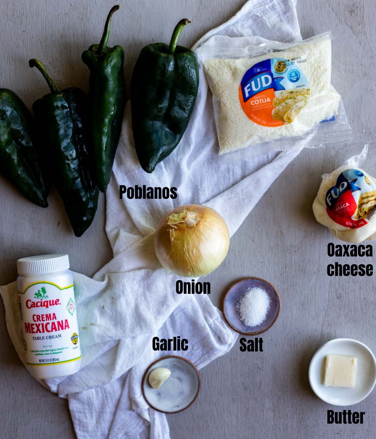 Ingredients to make rajas con crema arranged individually and labelled.