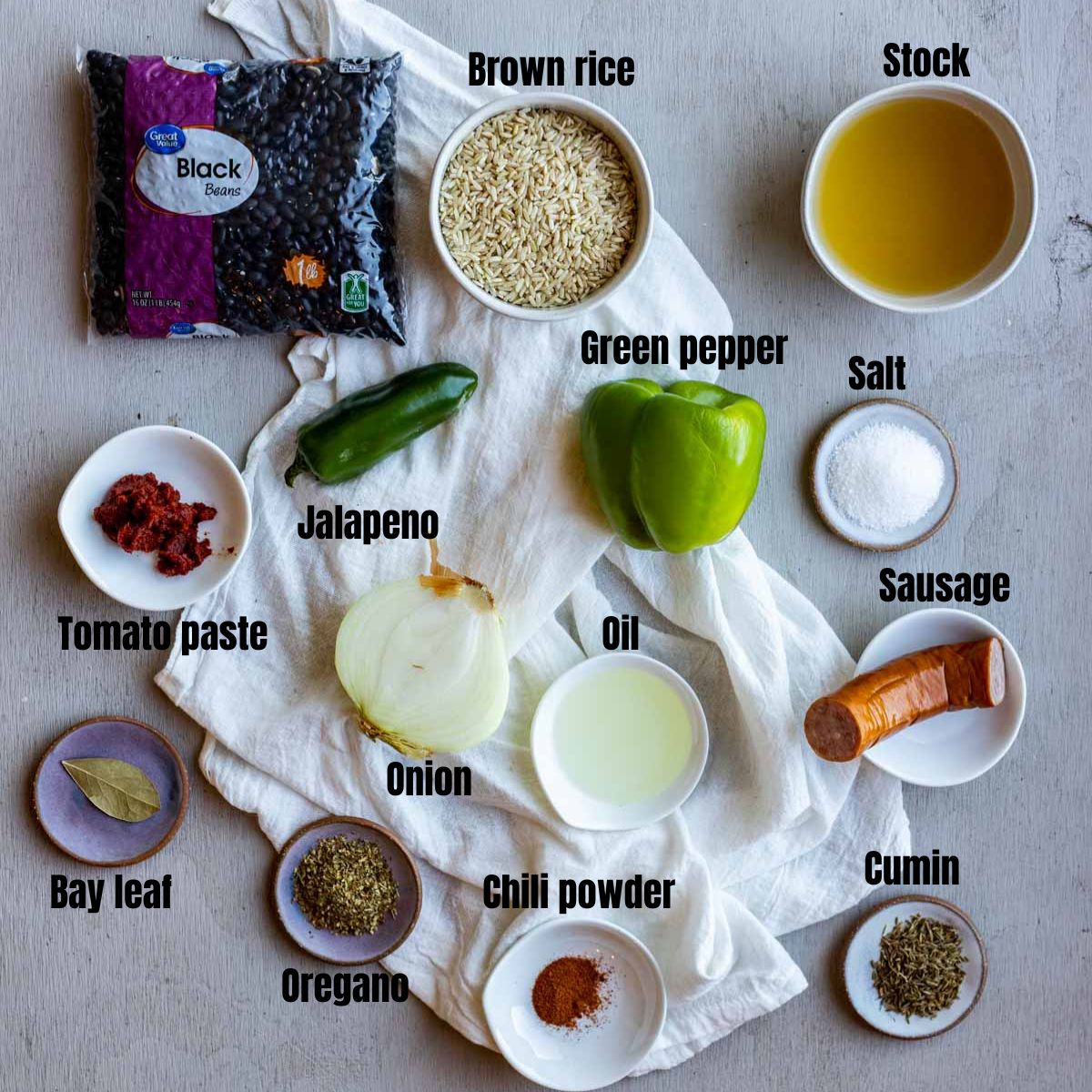 Ingredients to make Instant Pot black beans and rice arranged individually and labelled.