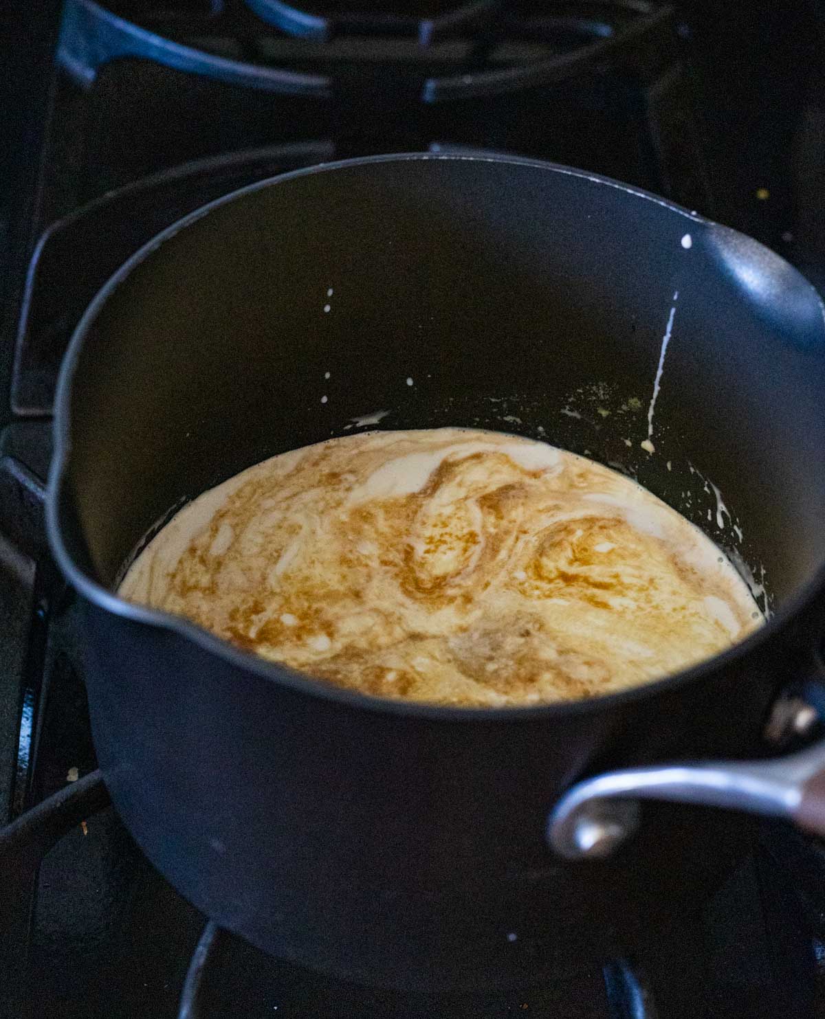 Milk, cream, vanilla, salt and sugar in a saucepan on the stovetop.
