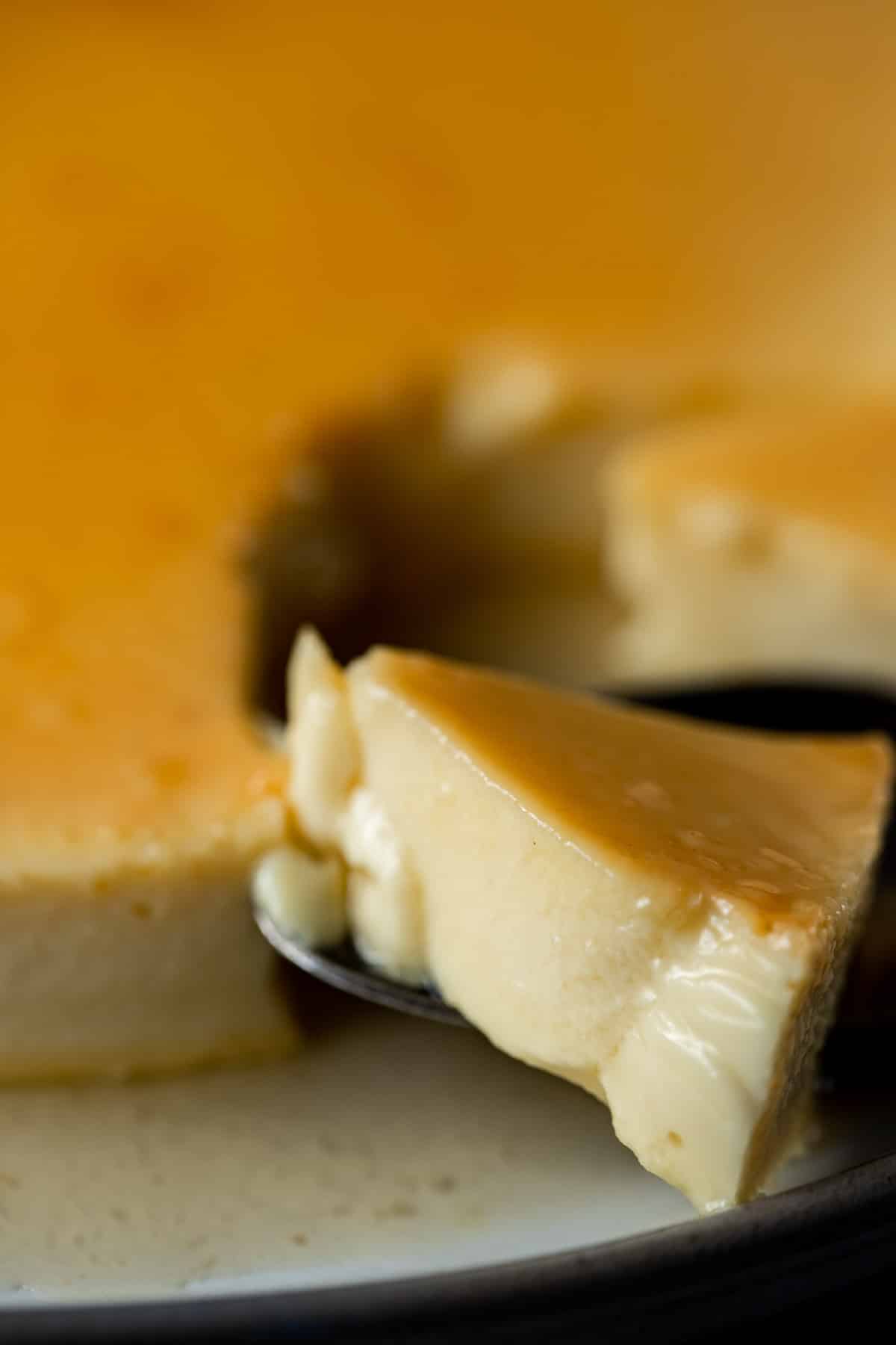 Close up view of a piece of creamy flan.