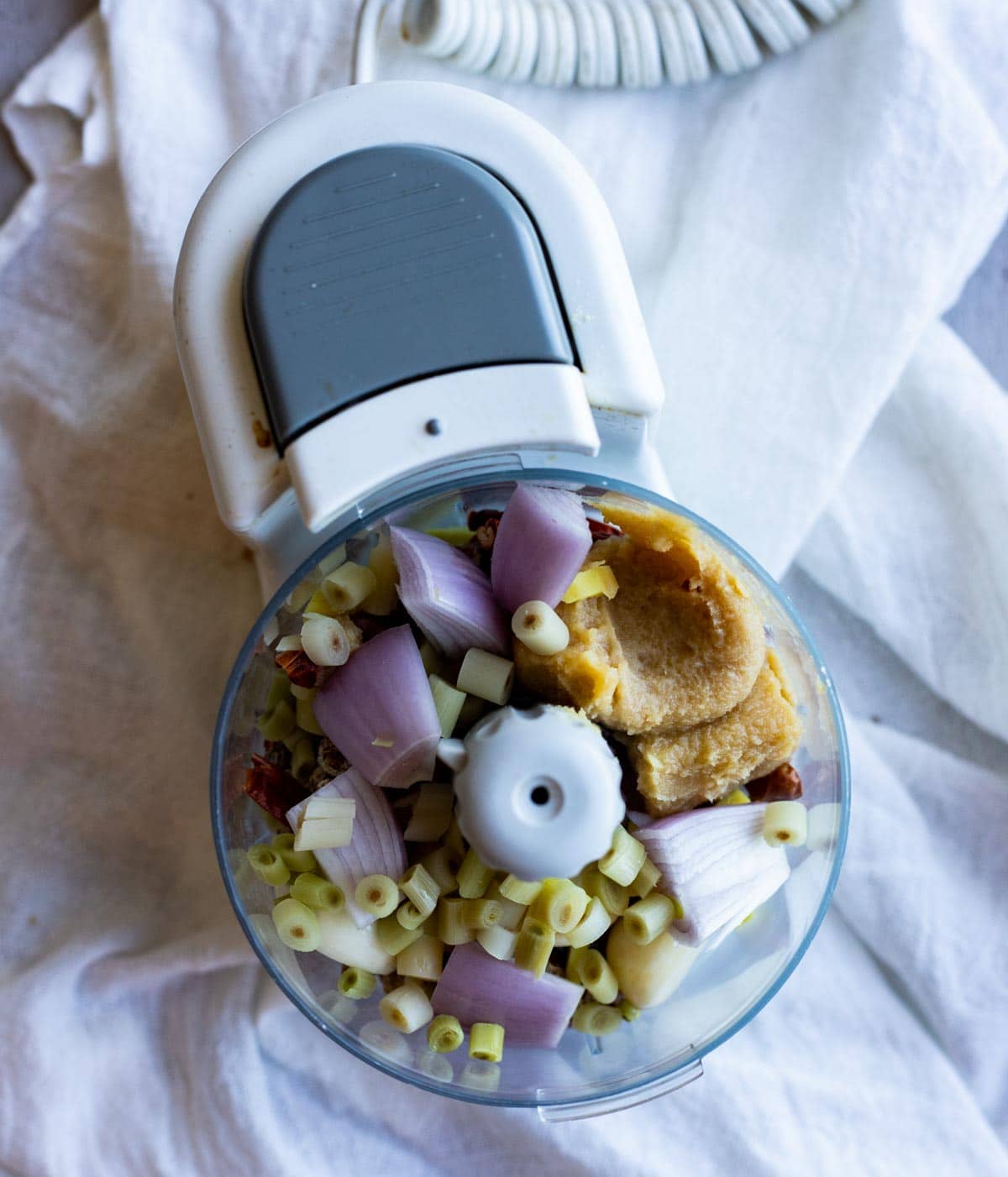 Ingredients to make chili paste in a food processor.