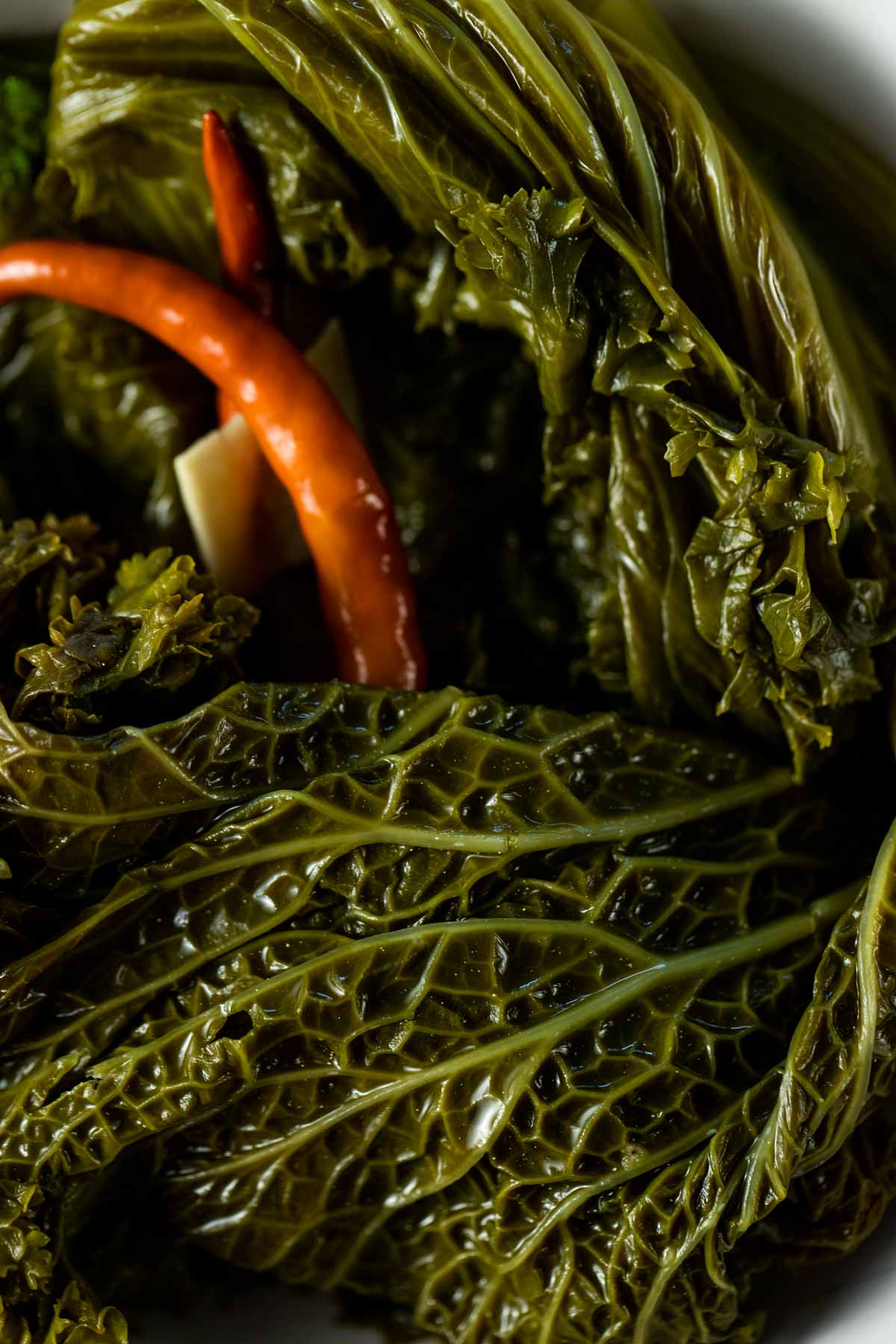 Close up view of pickled mustard greens.