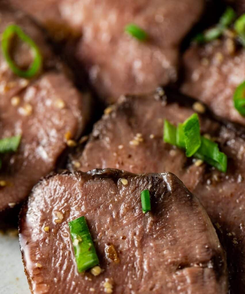 Close up view of sliced cow tongue.