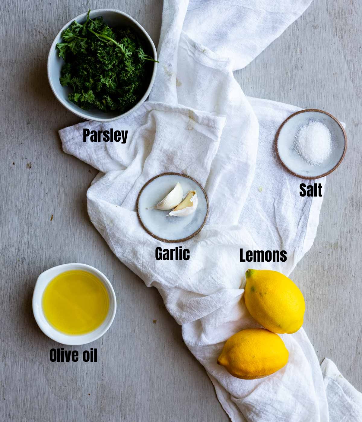Ingredients to make gremolata arranged individually and labelled.