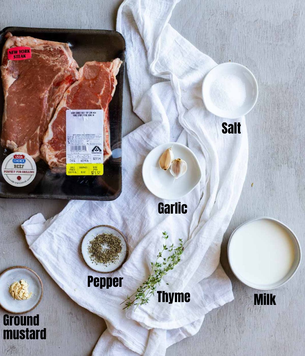 Ingredients to make milk steak arranged individually and labelled.