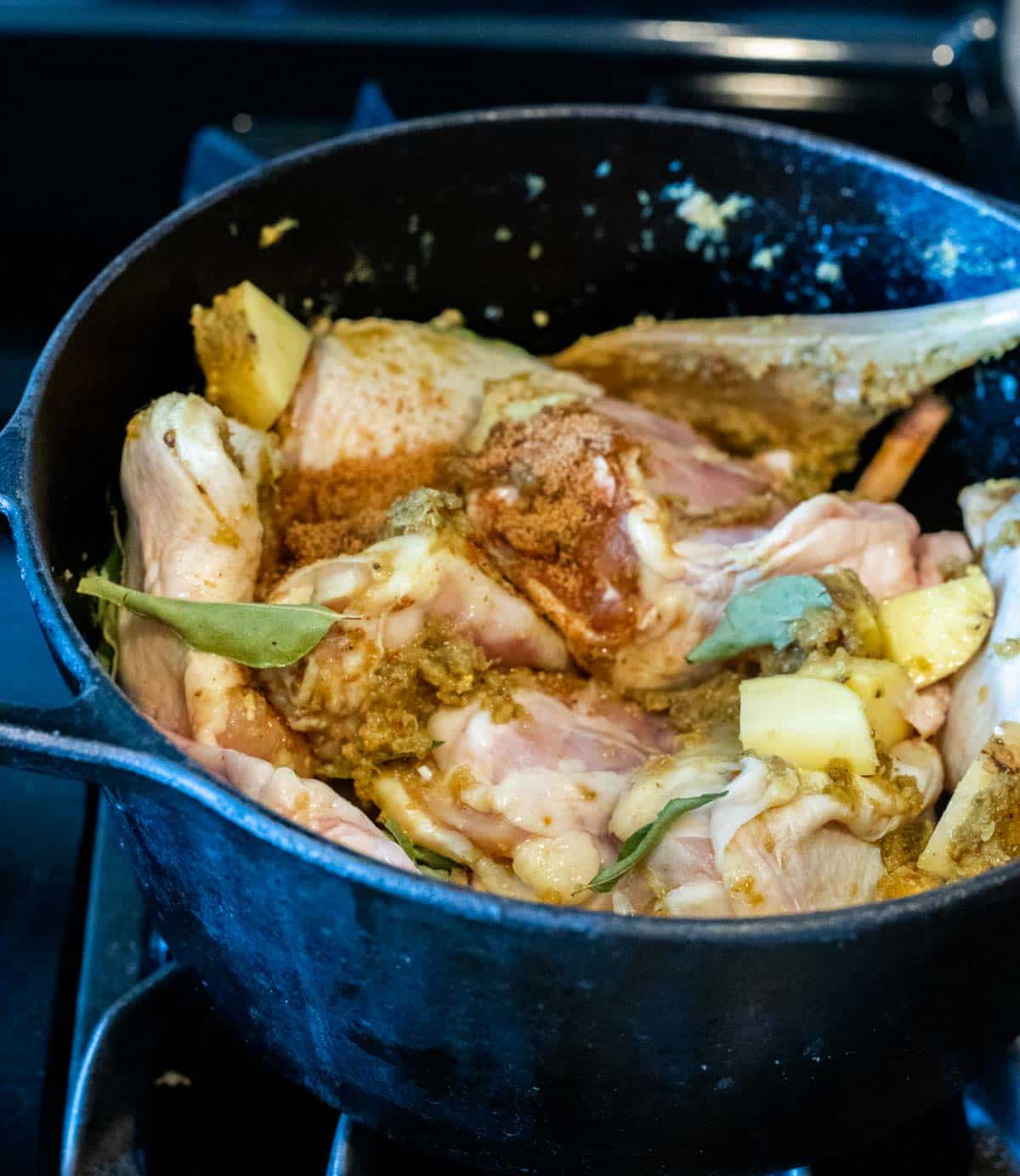 Chicken thighs, potatoes and remaining curry ingredients added to the Dutch oven.