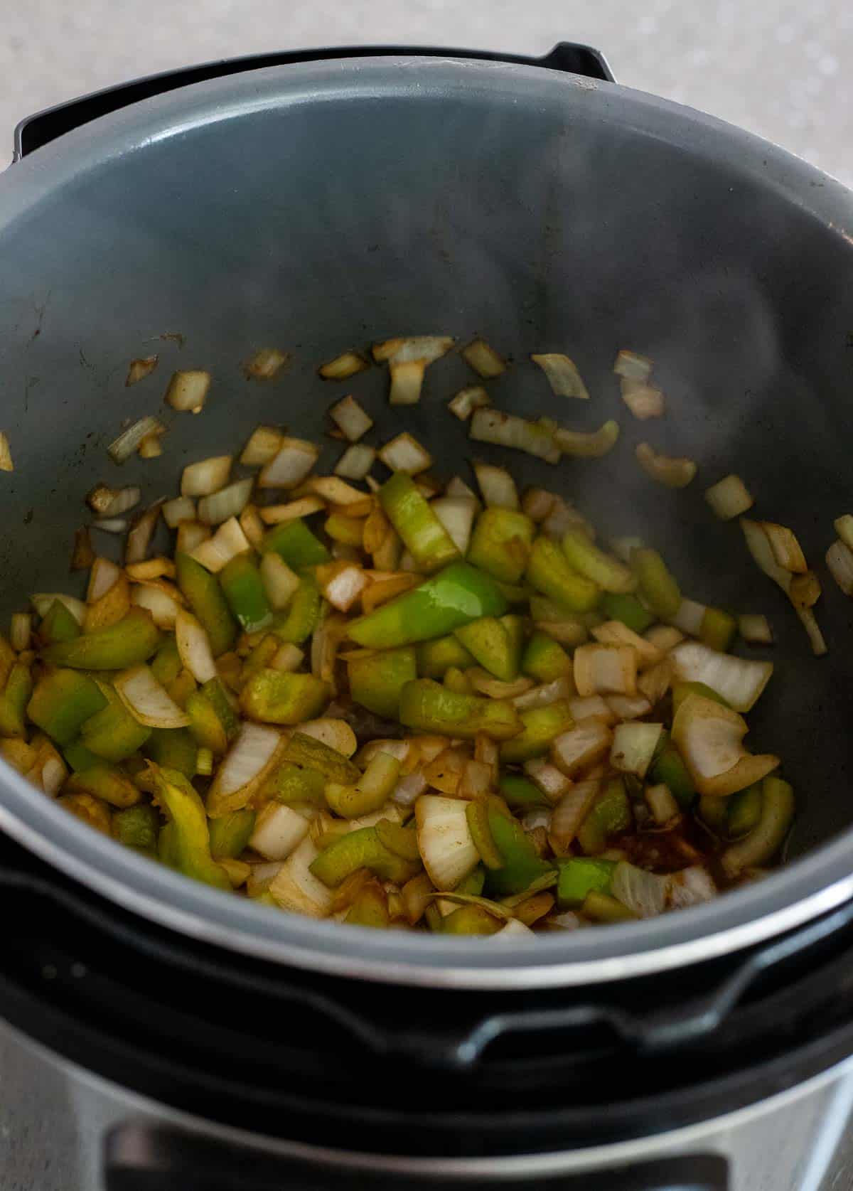 Chopped celery, onions and green peppers sautéing in the Instant Pot.