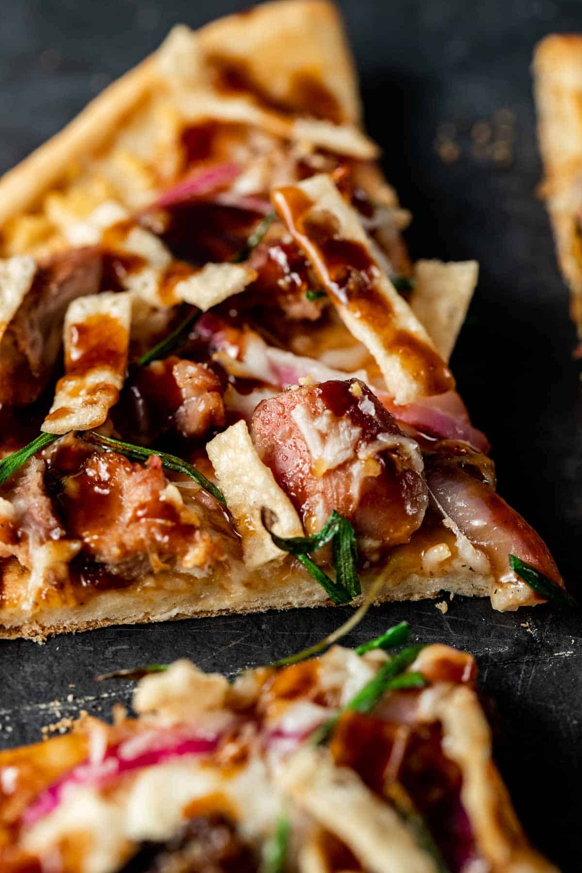 close up view of duck pizza cut up