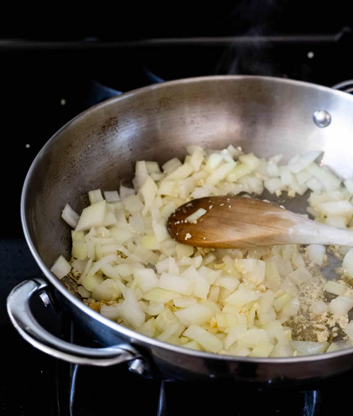 view of onions in a pan sauteing
