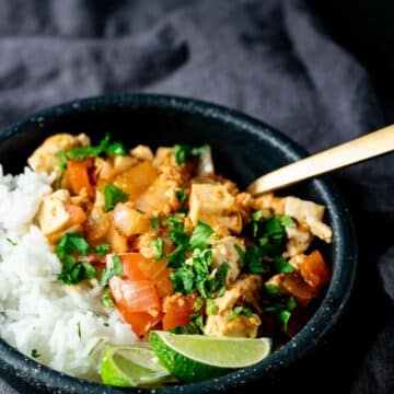 up close view of Sambal Tofu in a black bowl ready to serve