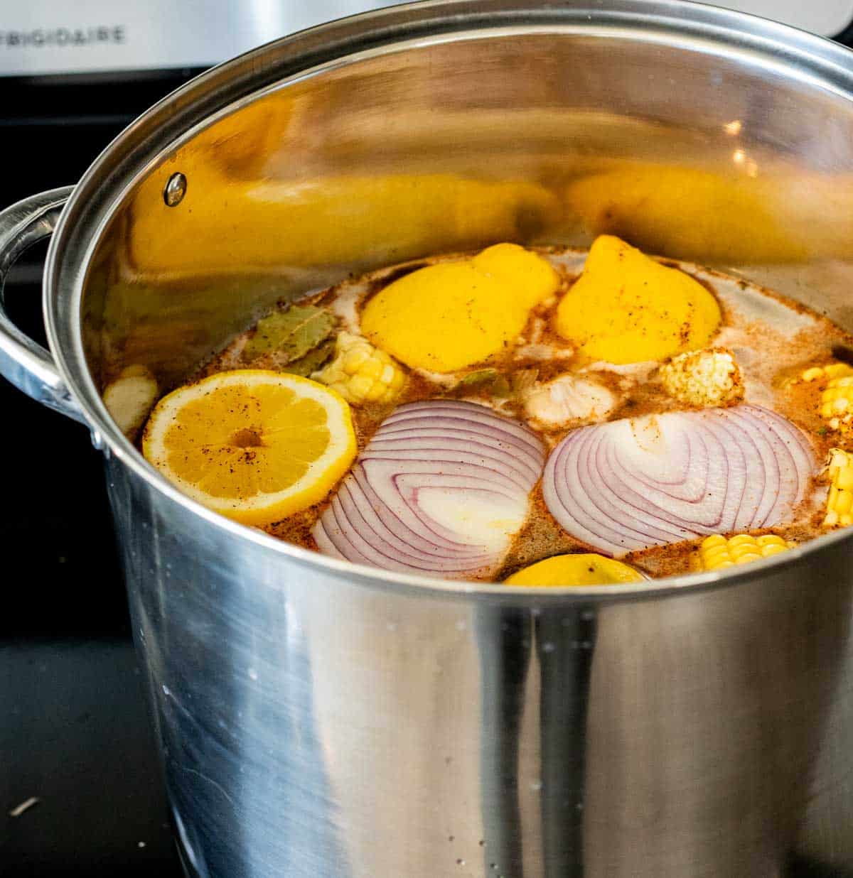 a pot of lemons and onion in liquid