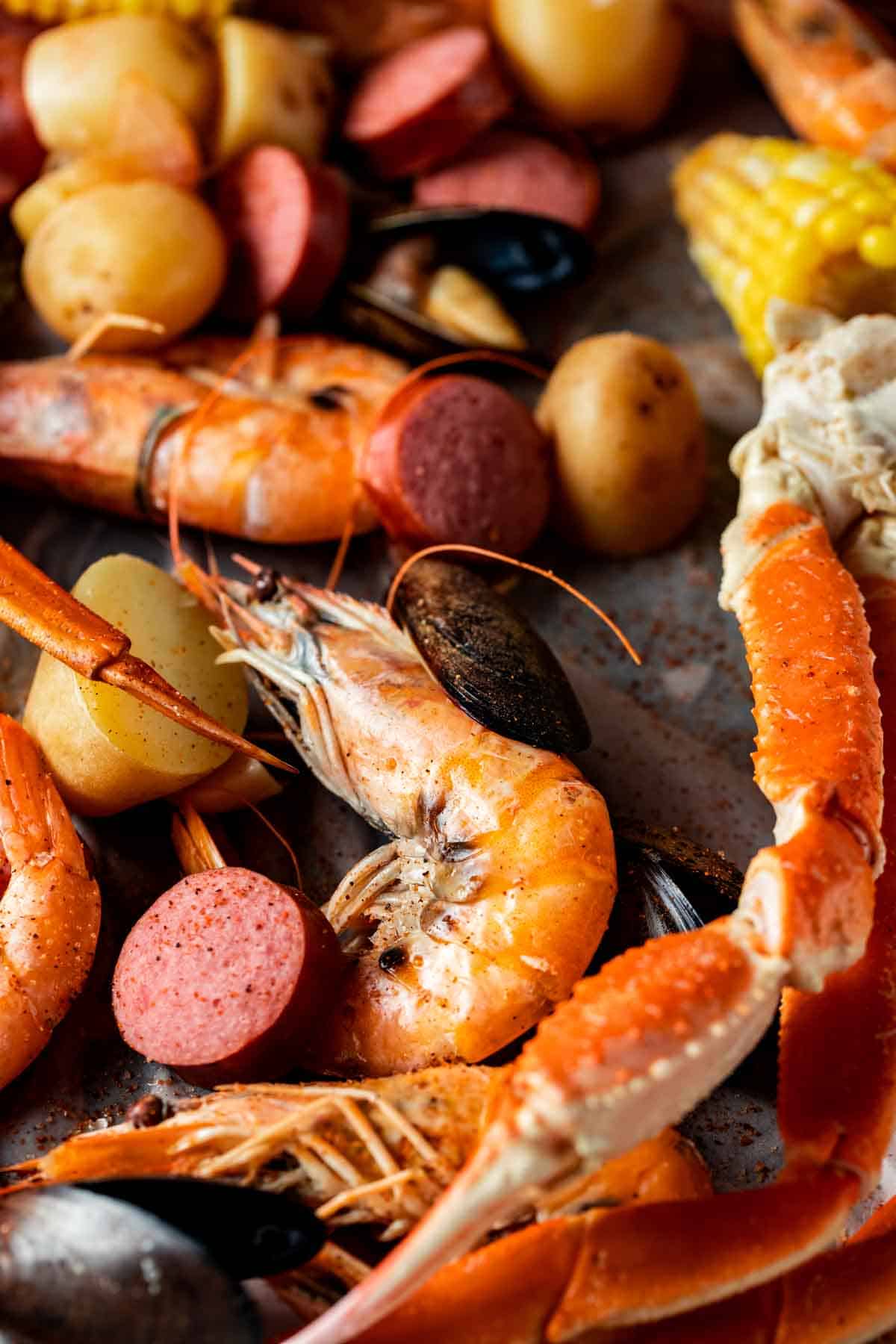 Cooked shellfish and sausage on a platter