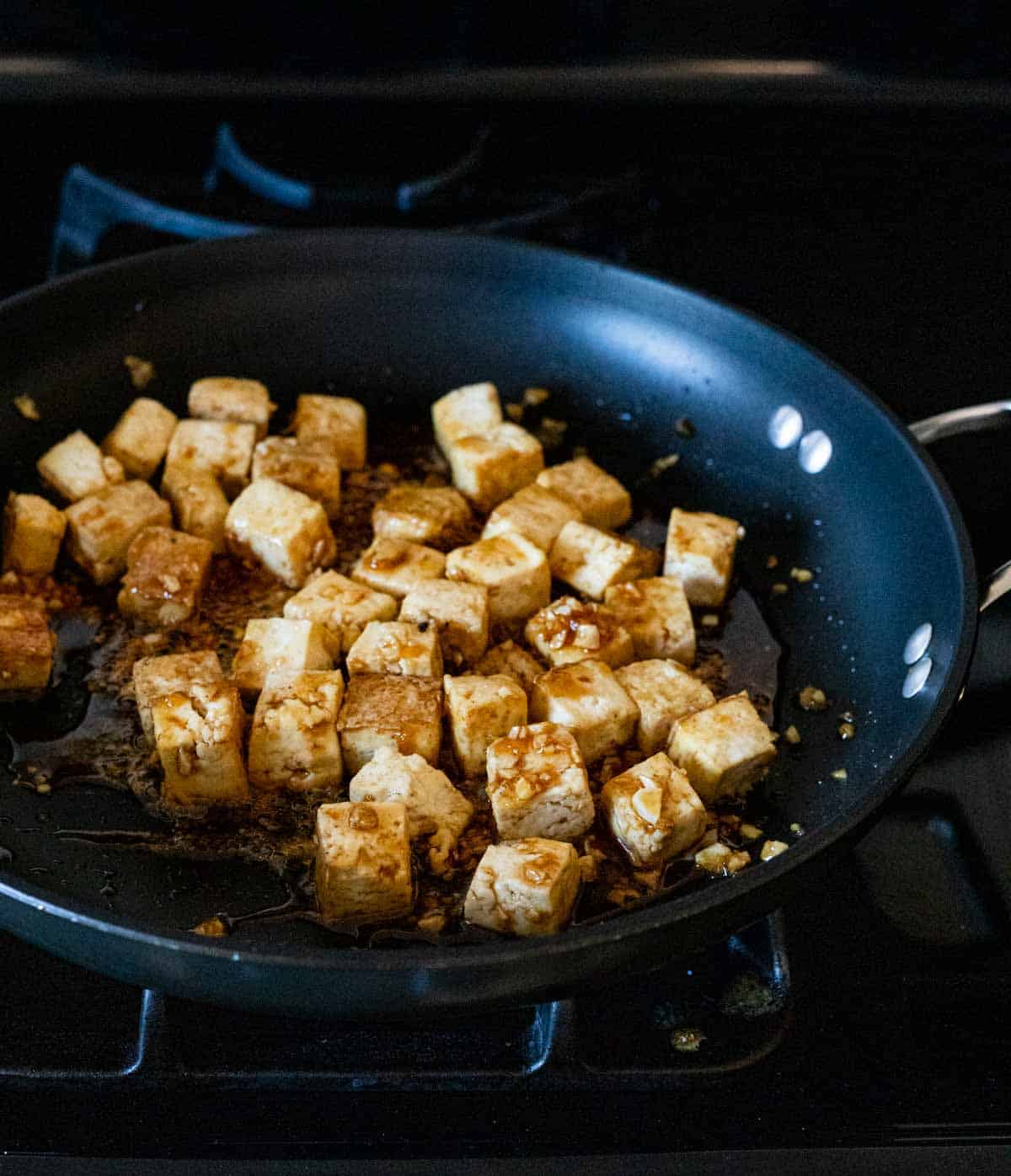 tofu on a pan being fried