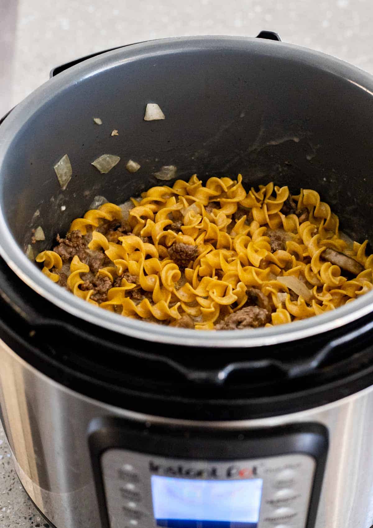 pasta, ground beef and mushrooms in an instant pot insert