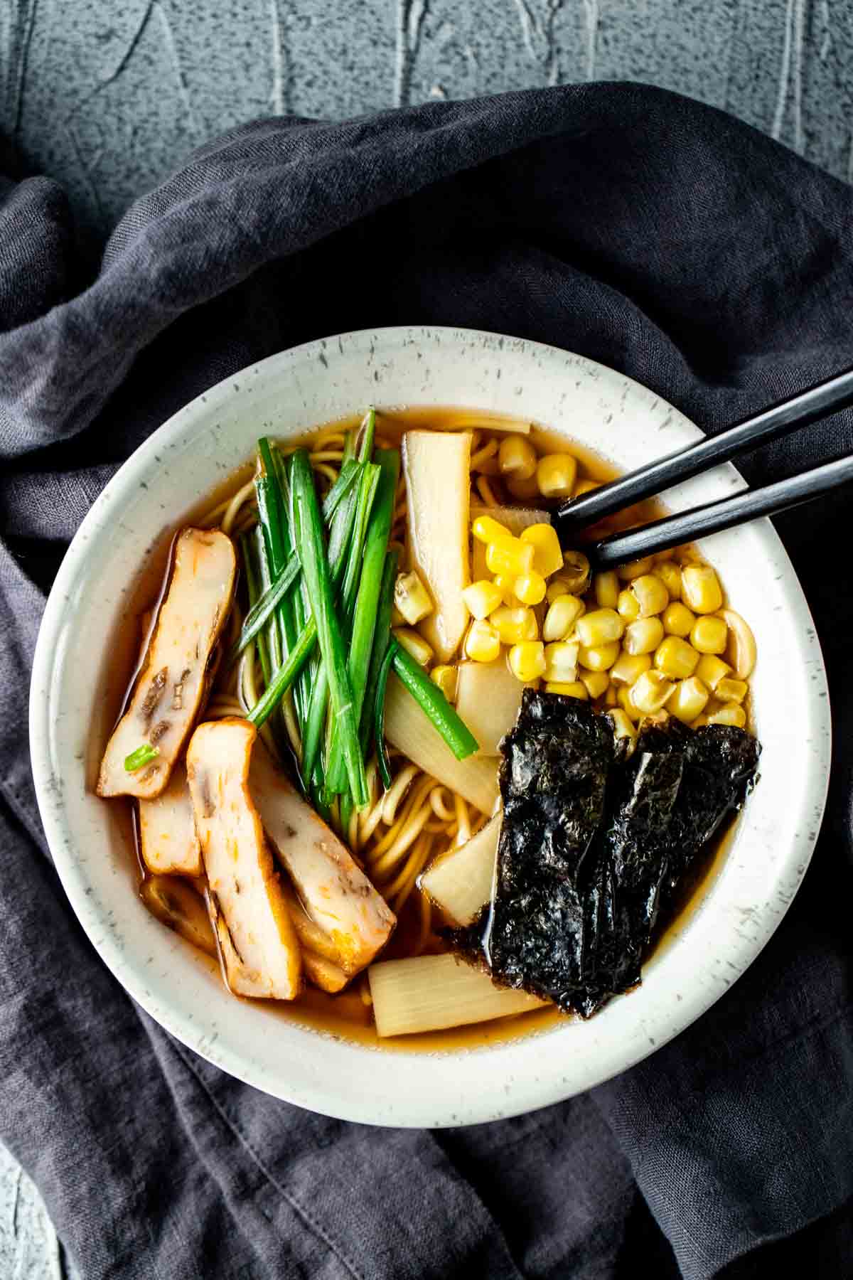 Noodle soupw ith corn, green onions, bamboo shoots and fish cake