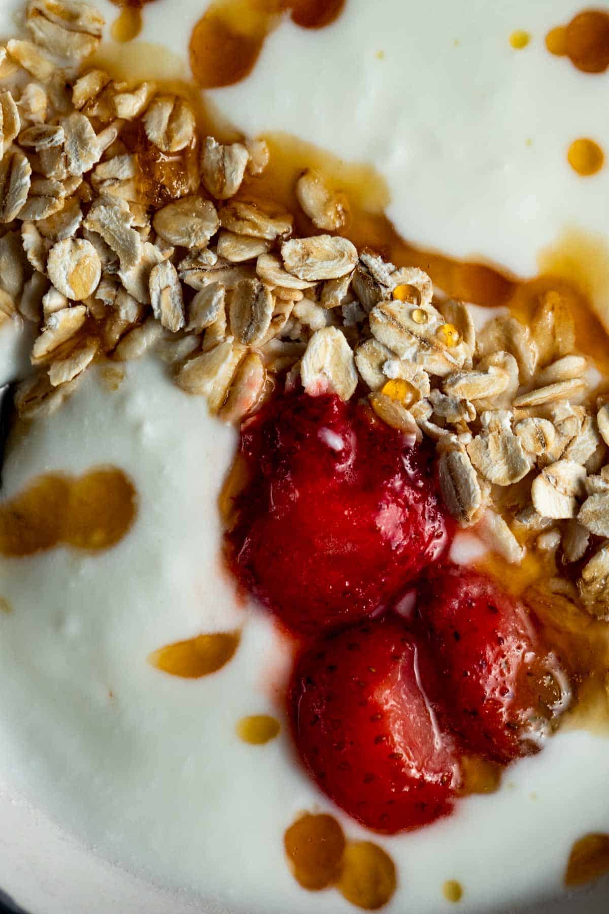yogurt, berries and granola close up