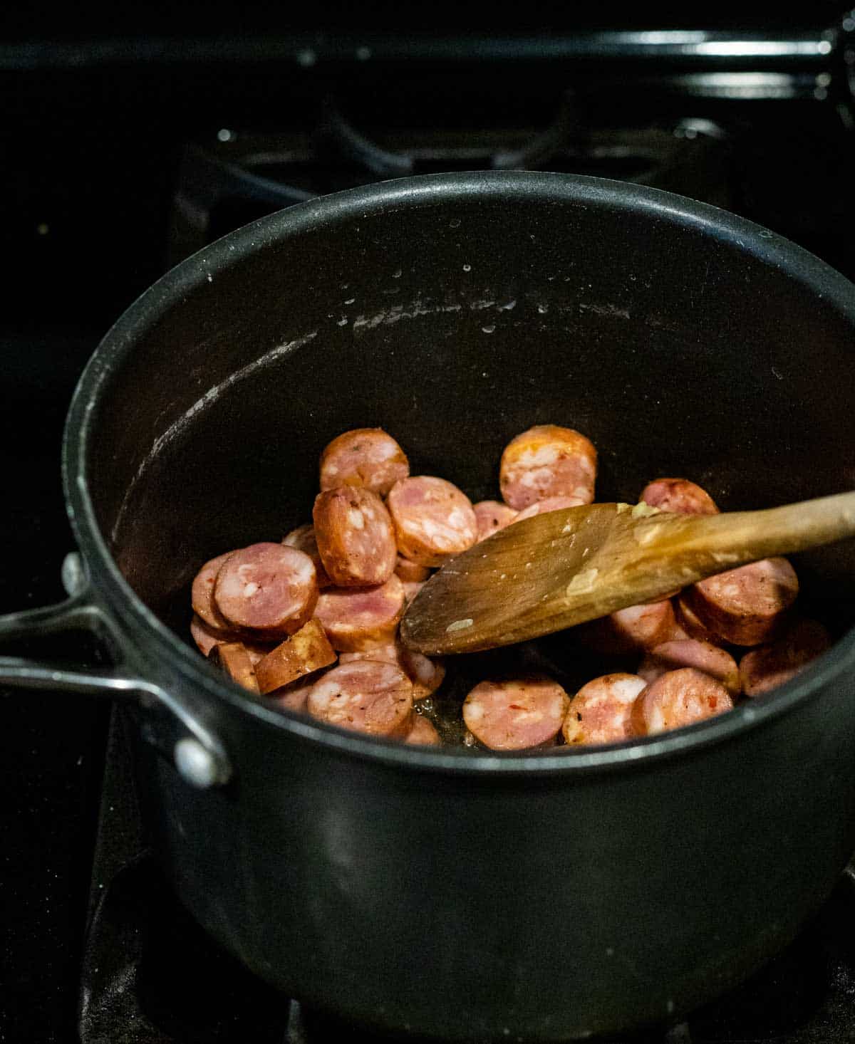 sausage cooking in a pot
