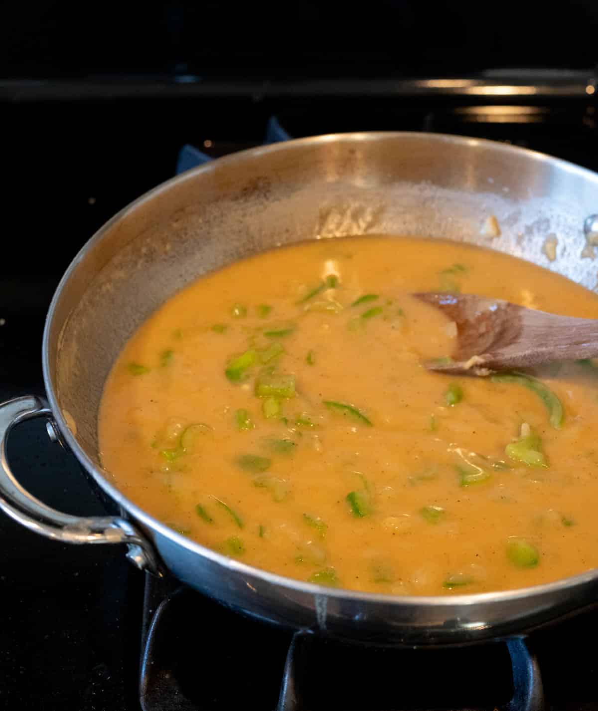 a yellow sauce cooking in a skillet