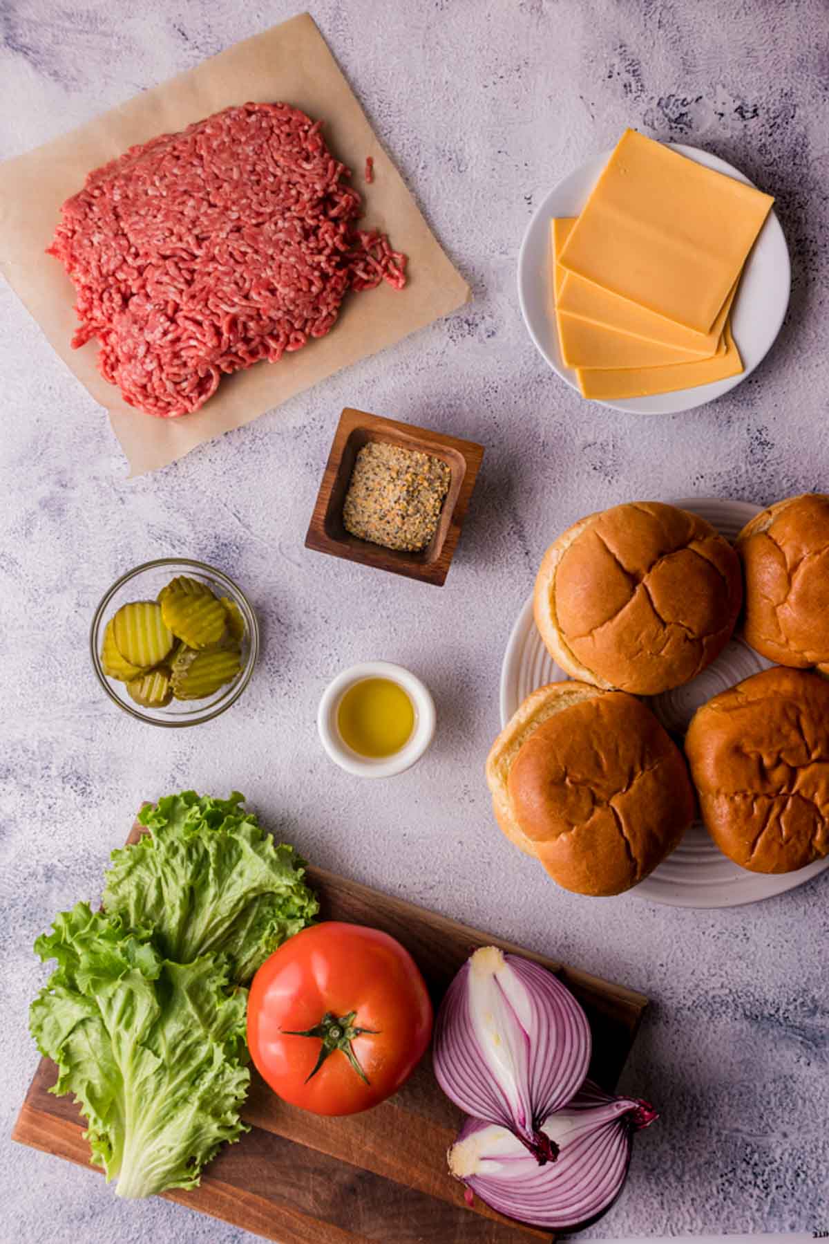 ingredients on a board to make sous vide hamburgers
