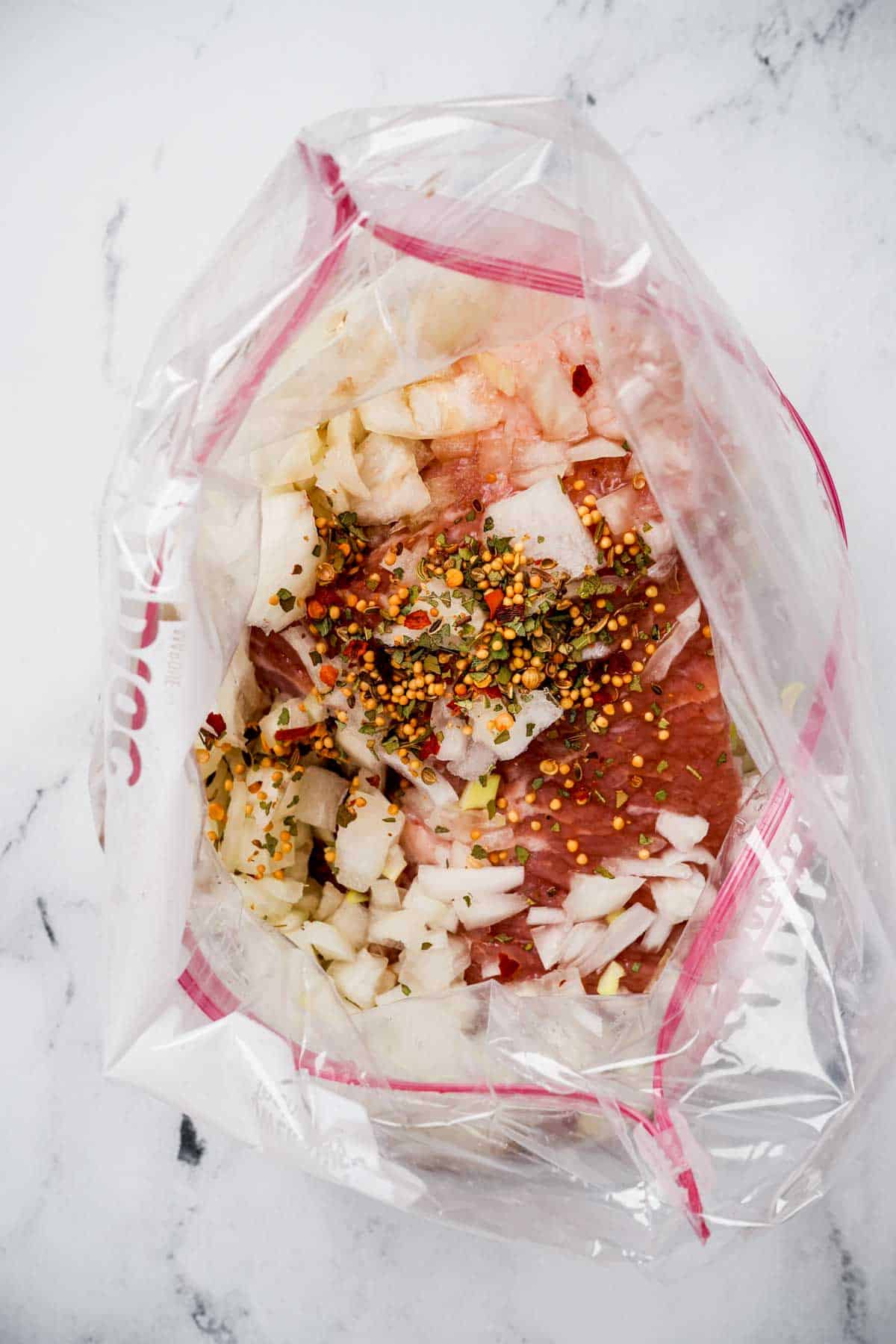 beef in a bag with seasonings and aromatics