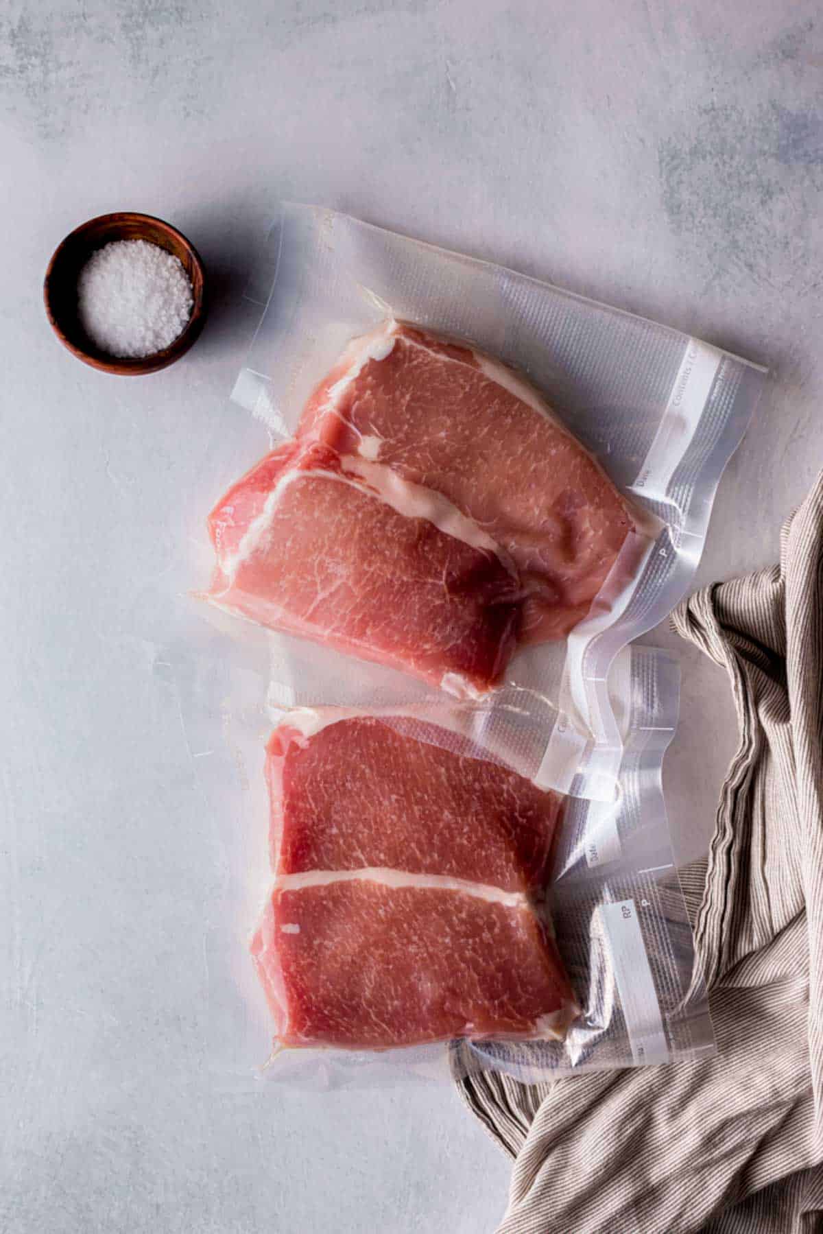 raw pork chops in vacuum seal bags