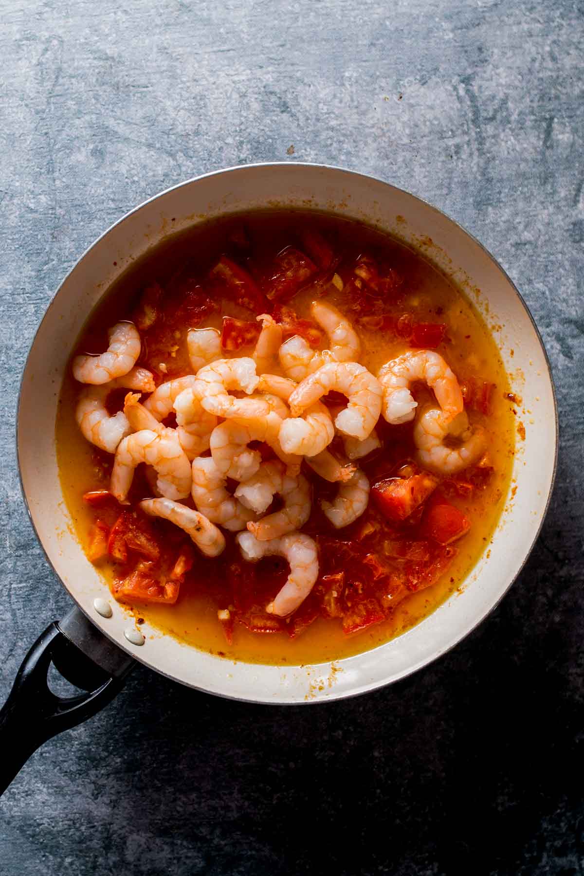 shrimp in a pan with tomato sauce