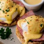 eggs benedict topped with hollandaise sauce