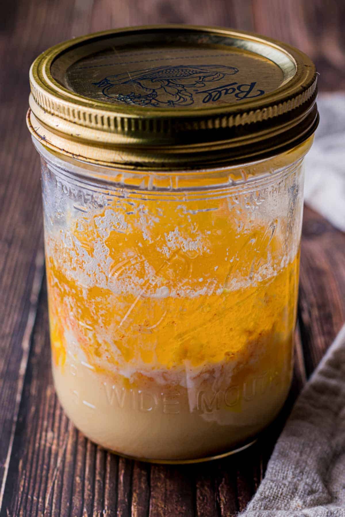 a jar of yellow liquid