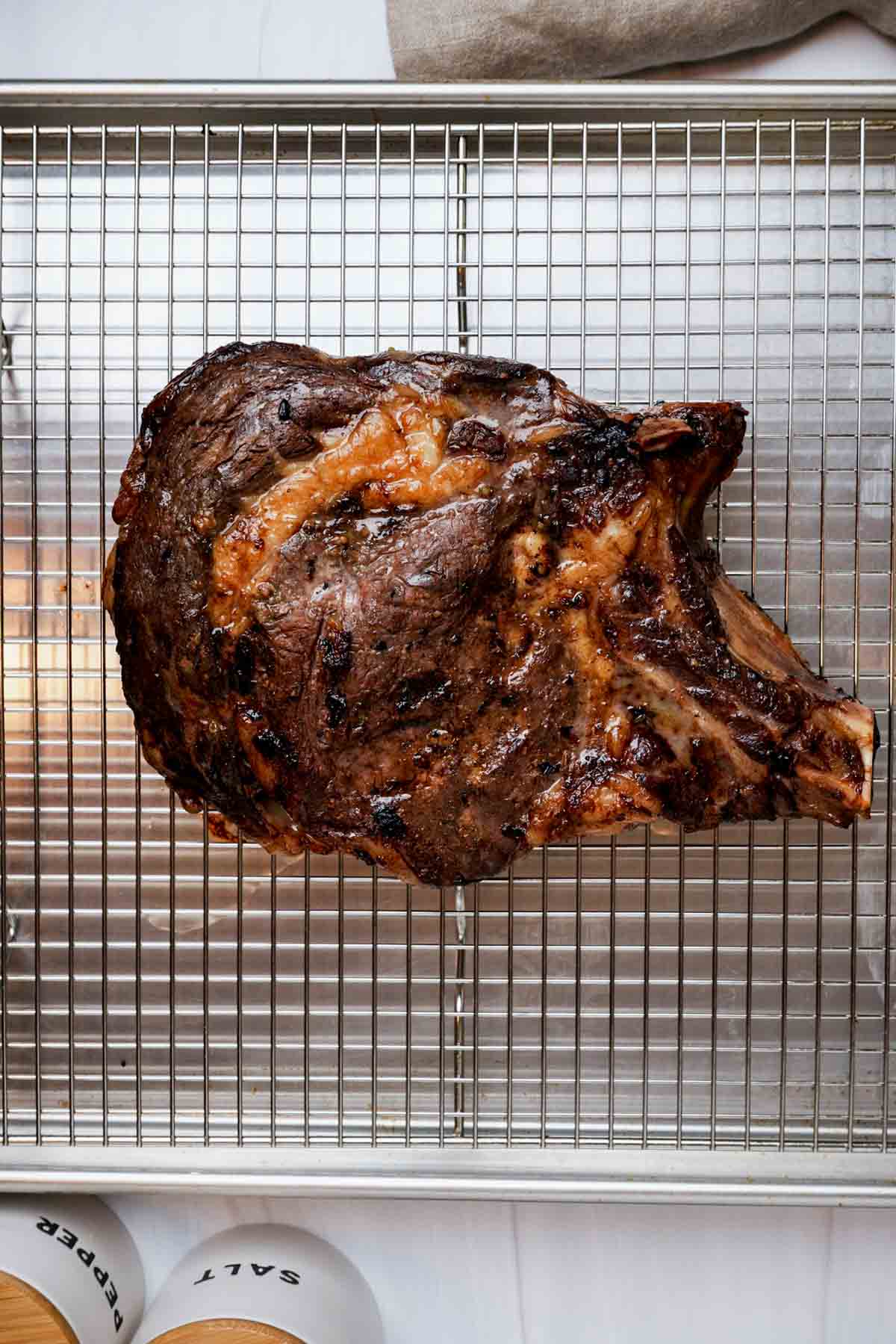 roasted prime rib on a baking rack