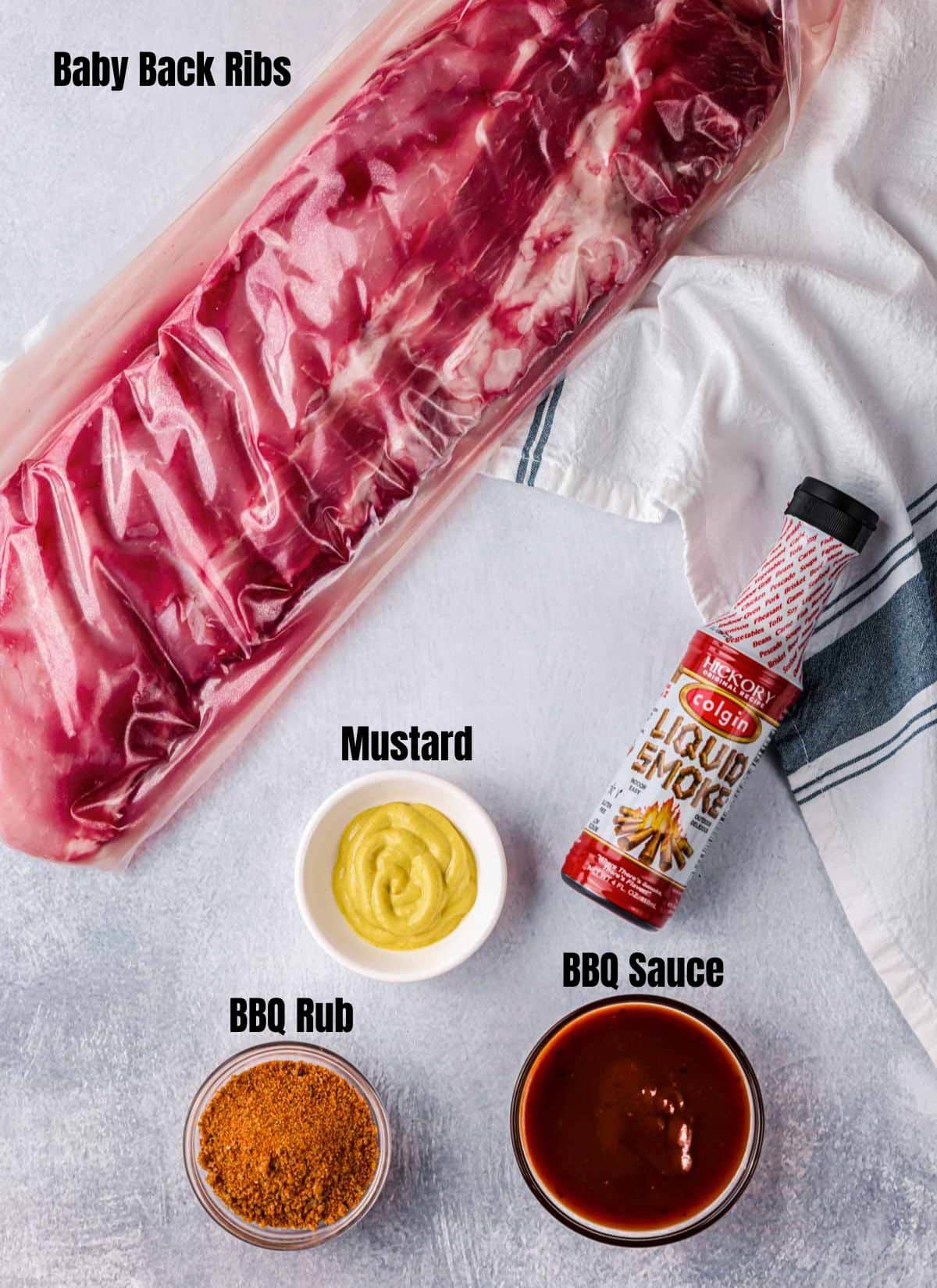 ingredients for sous vide baby back ribs on a white durface