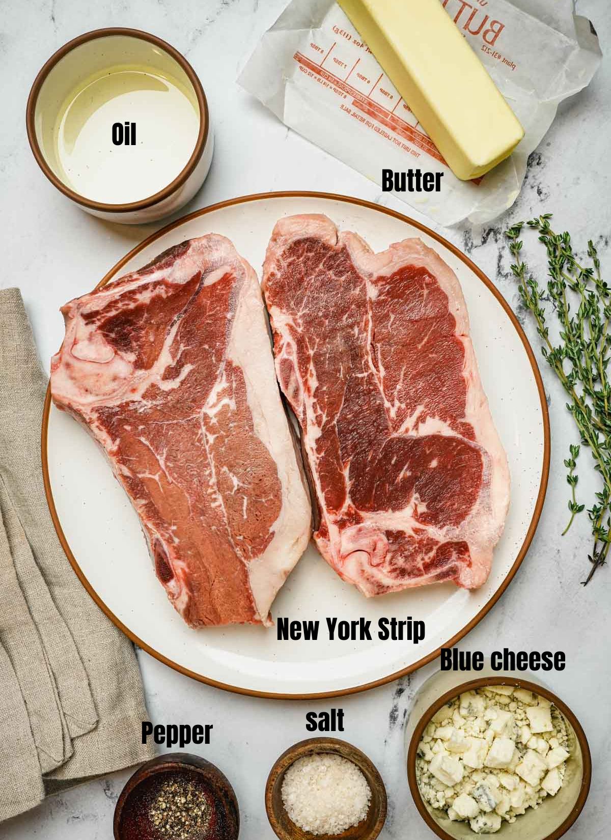 ingredients for sous vide new york strip on a surface