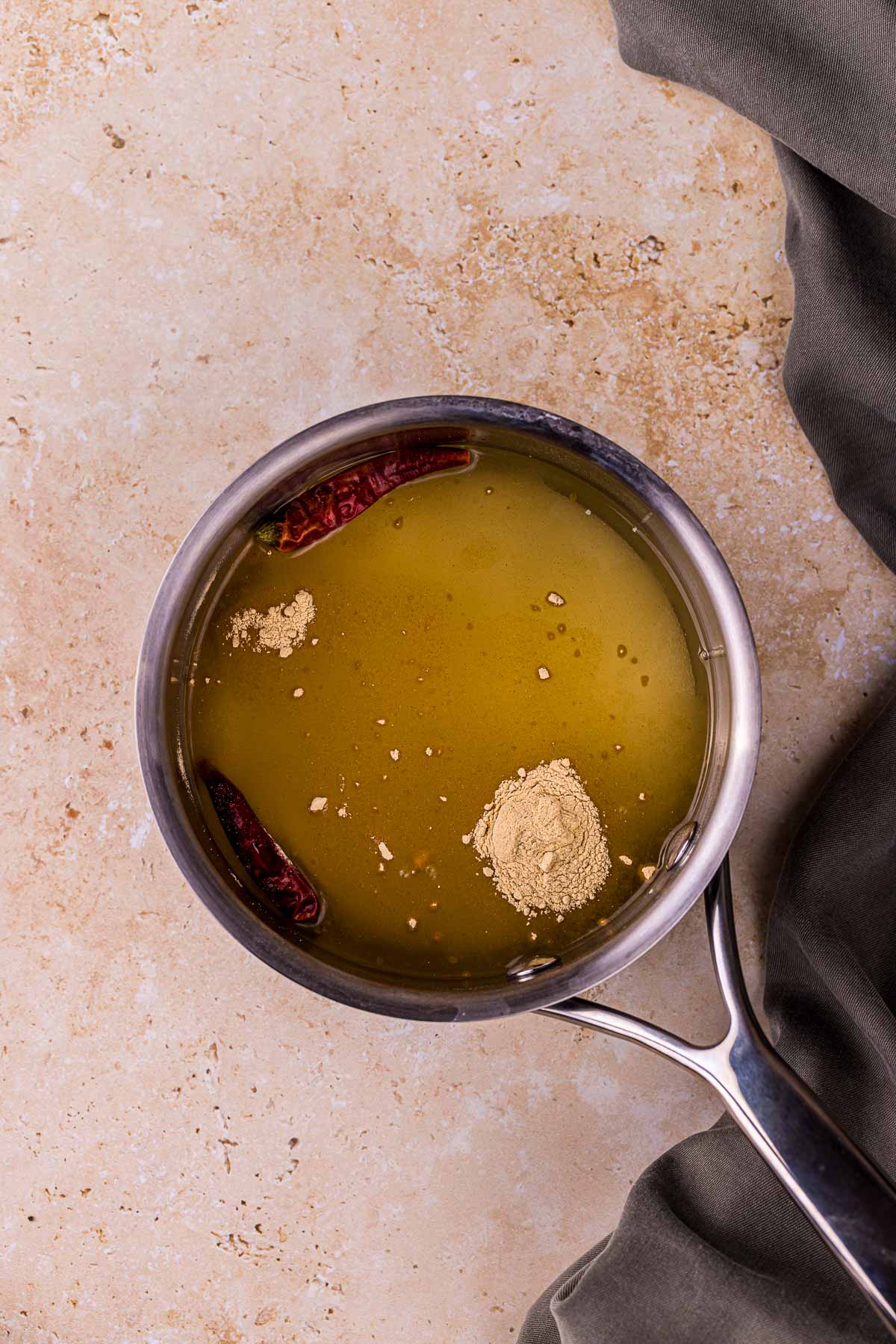 a saucepan with yellow liquid