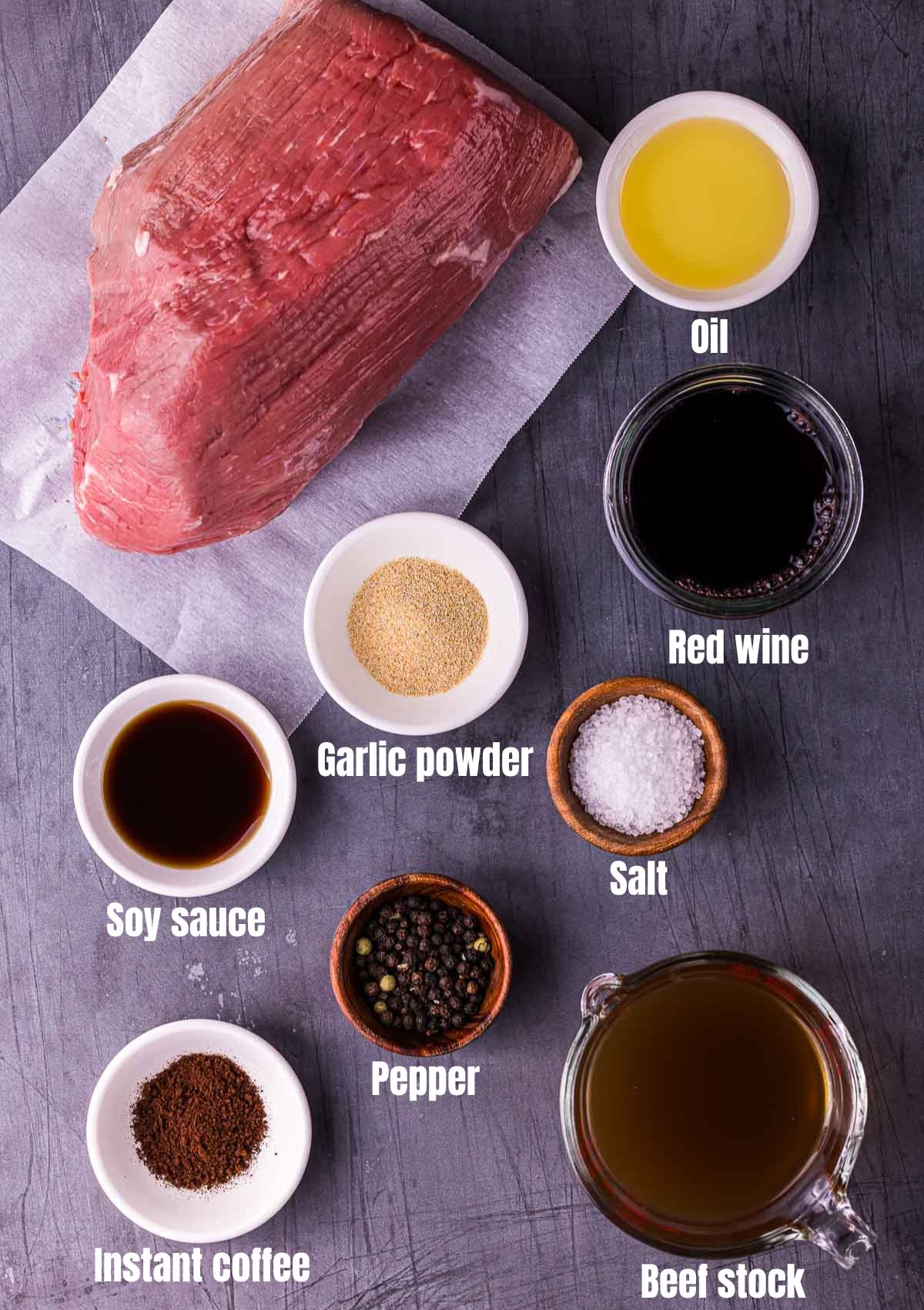 ingredients for sous vide eye of round on a grey surface with text