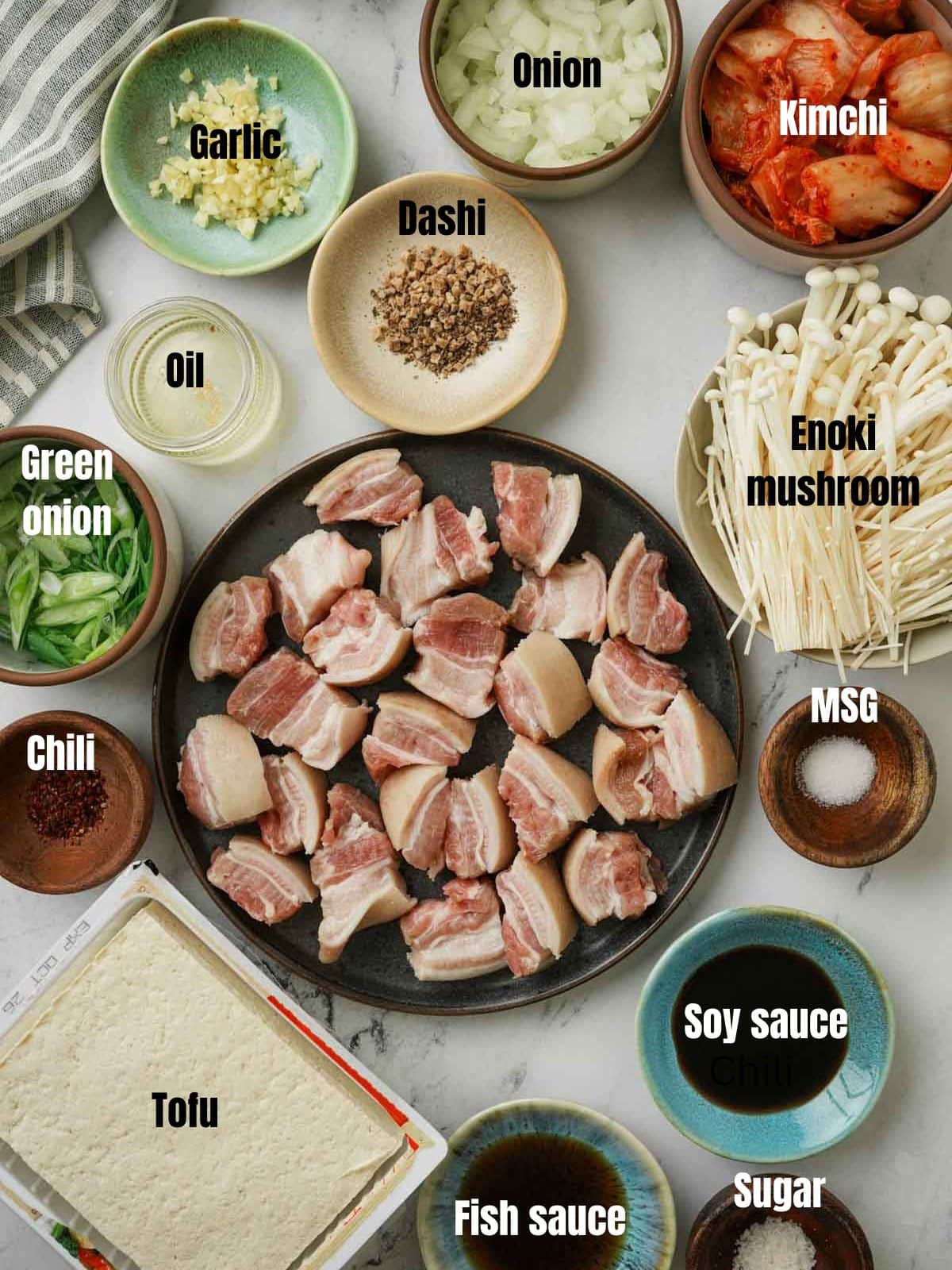 ingredients for spicy tofu soup on a grey surface