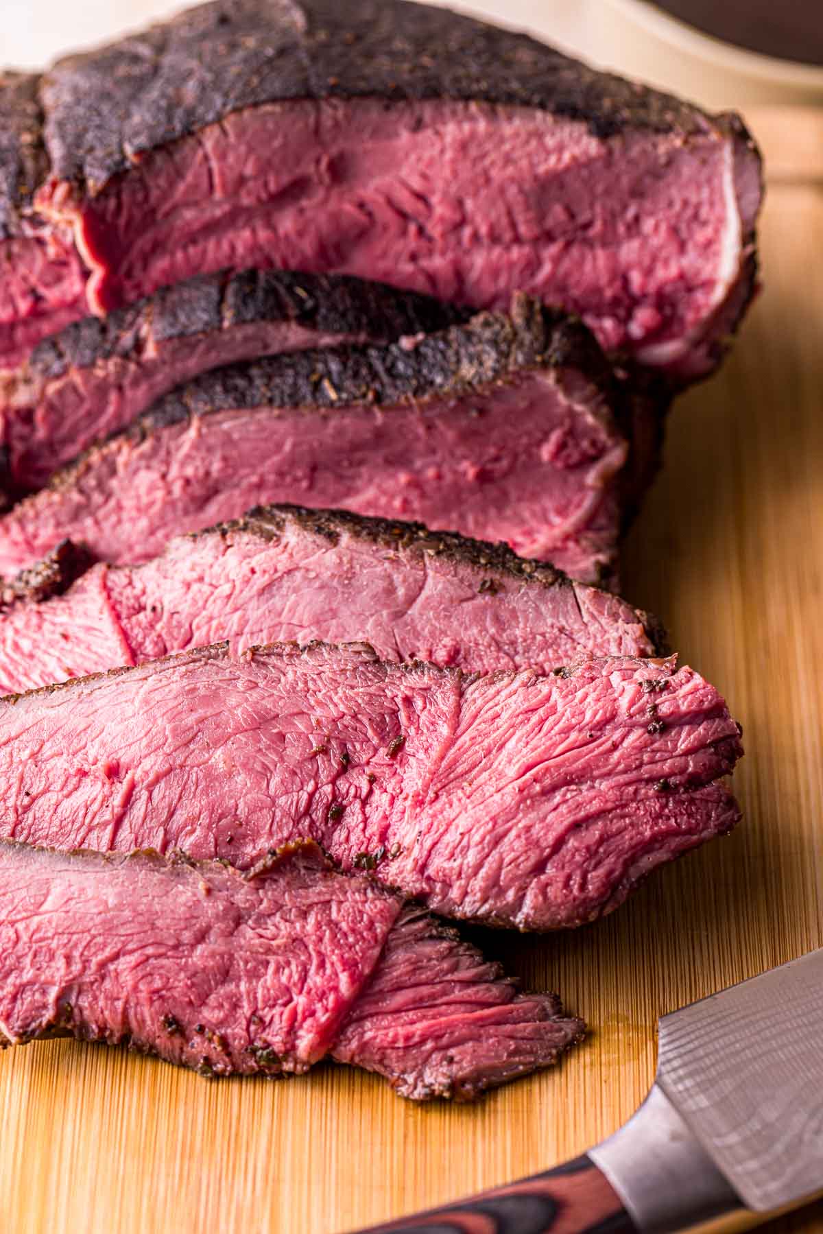 sliced roast beef on a cutting board