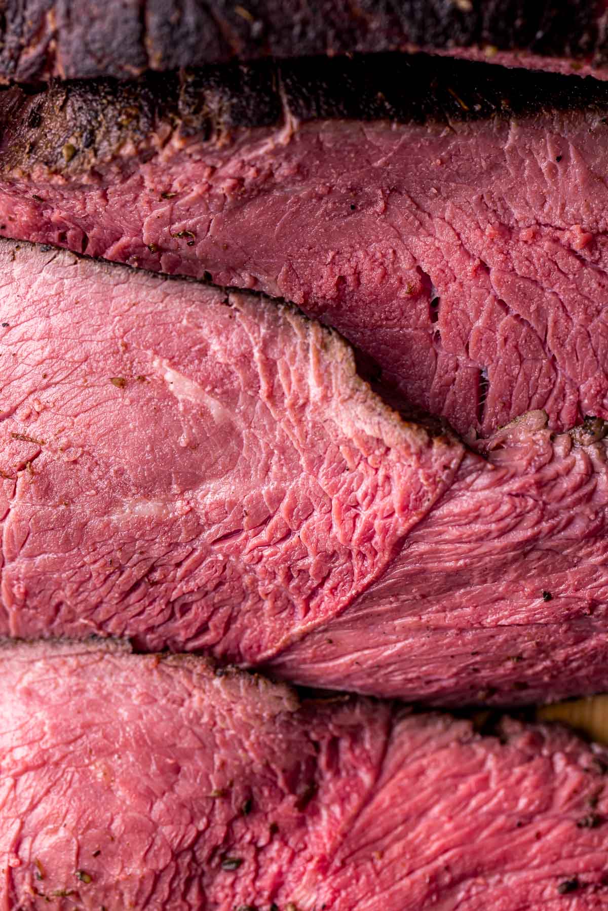 close up of slices of medium rare cooked beef