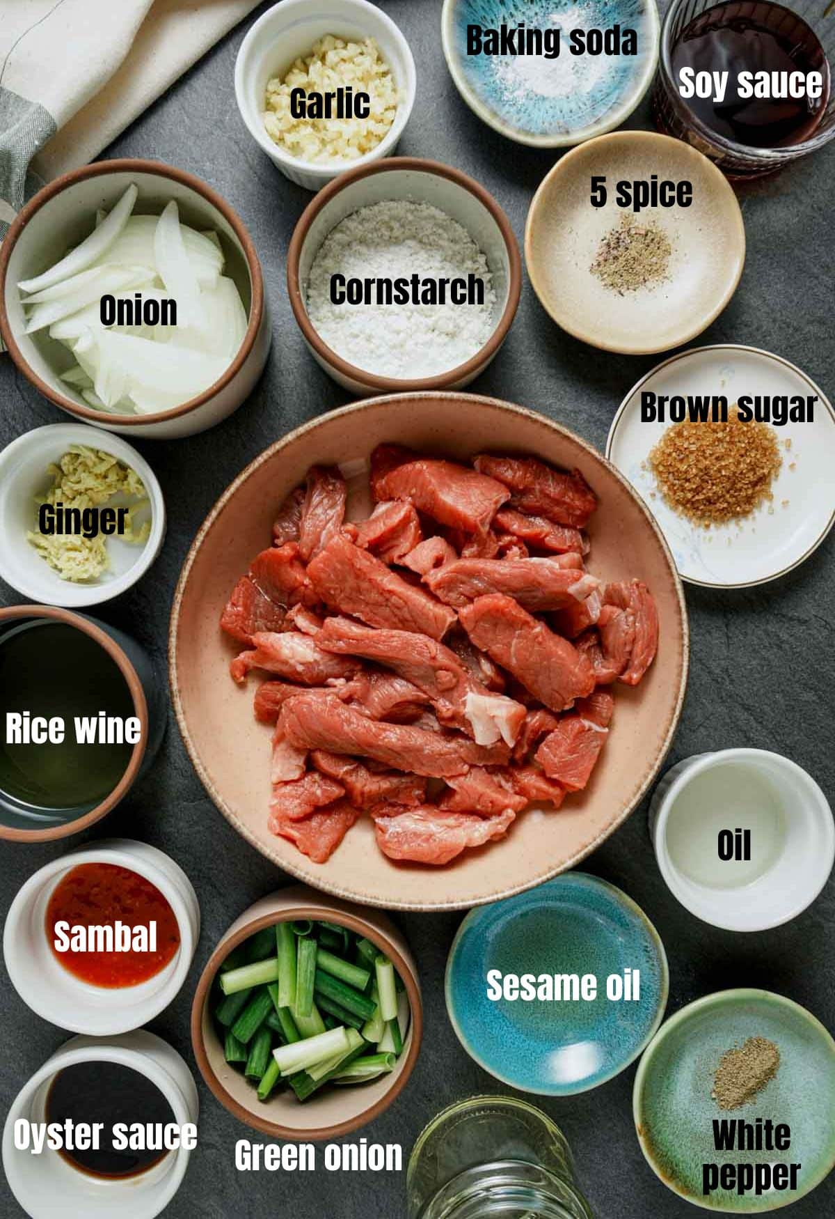 ingredients for mongolian lamb on a grey surface