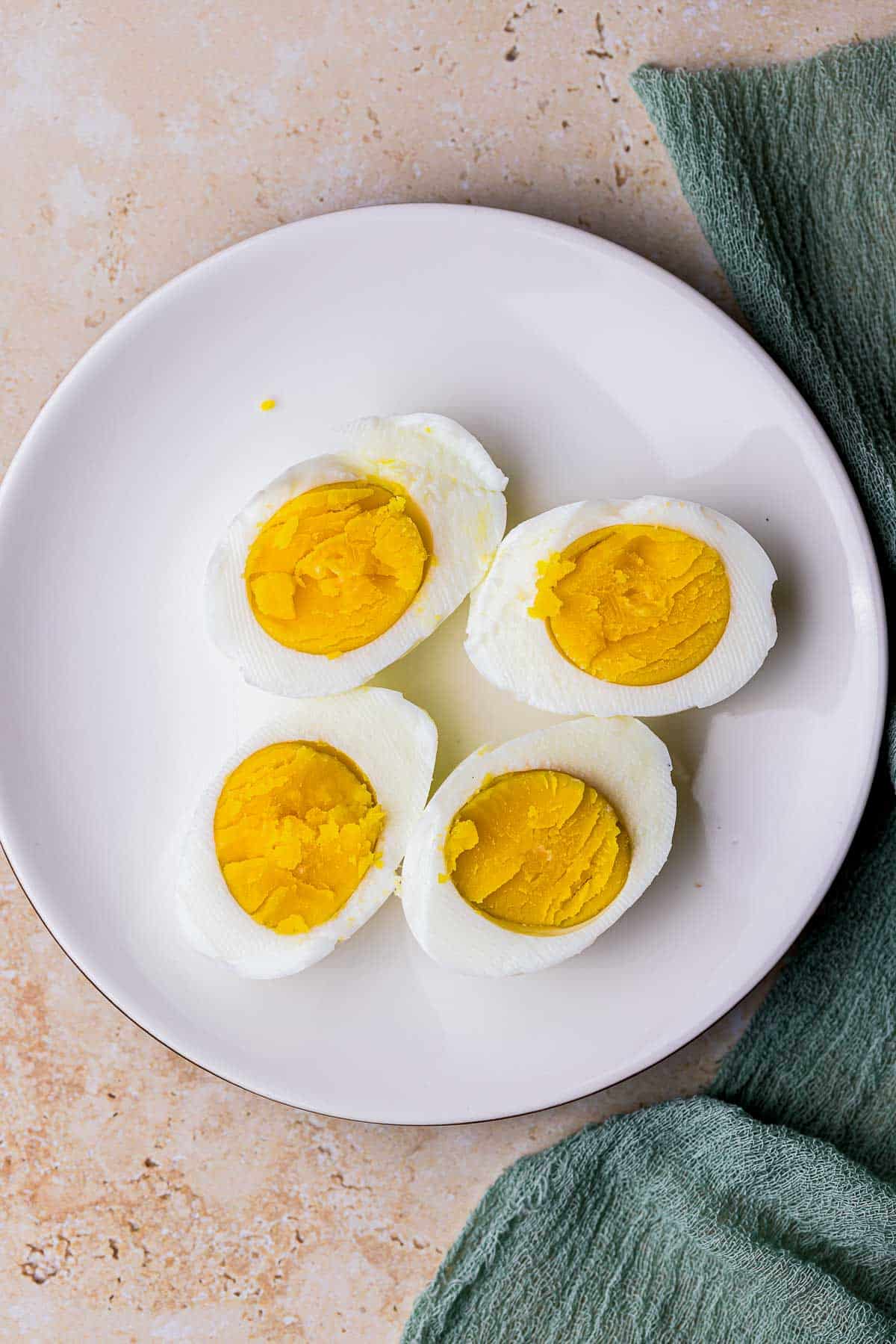 halved hard boiled eggs on a plate