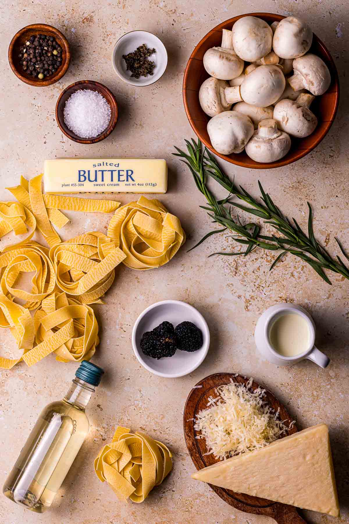 ingredients for truffle pasta on a brown board