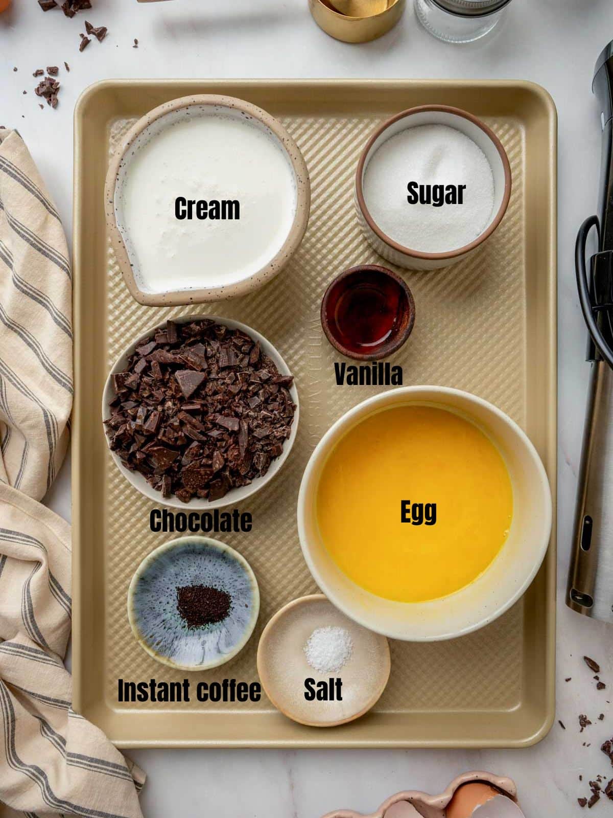ingredients for sous vide pots de creme on a gold baking sheet