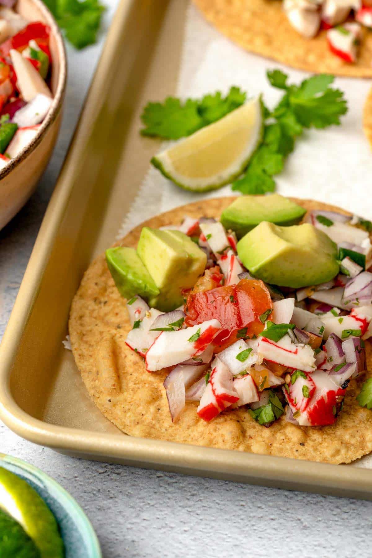 crab ceviche on a tostada with avocado