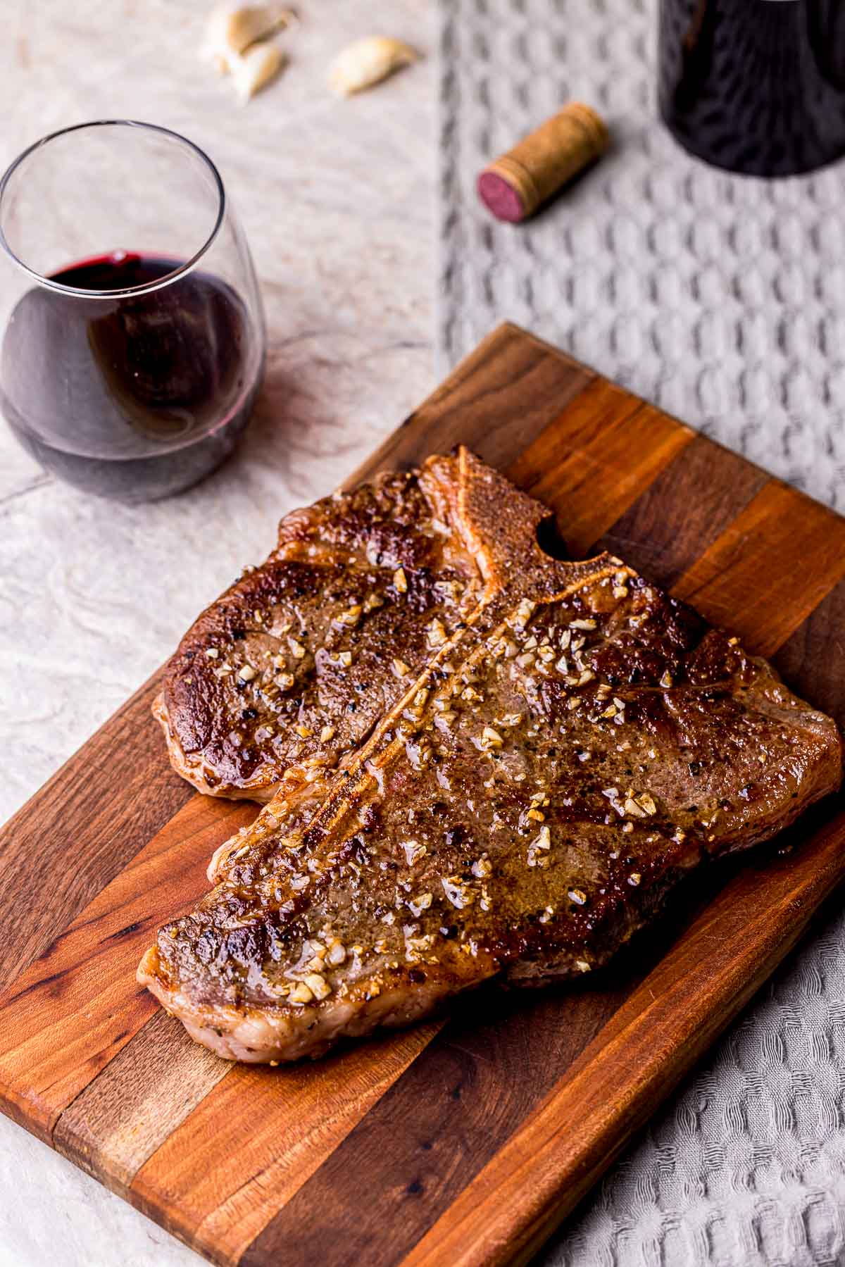 a browned steak on a cutting board