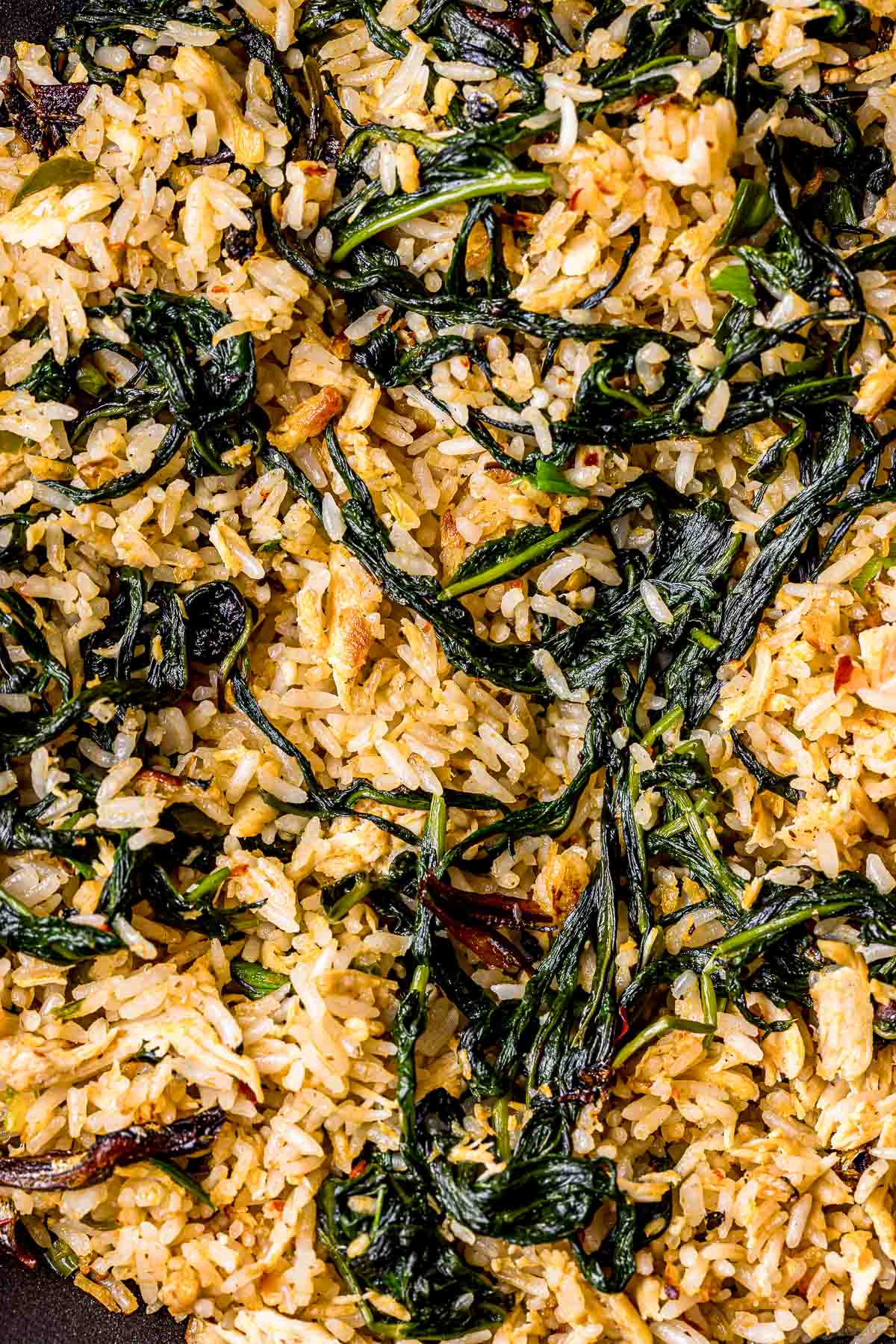 fried rice with cooked greens throughour